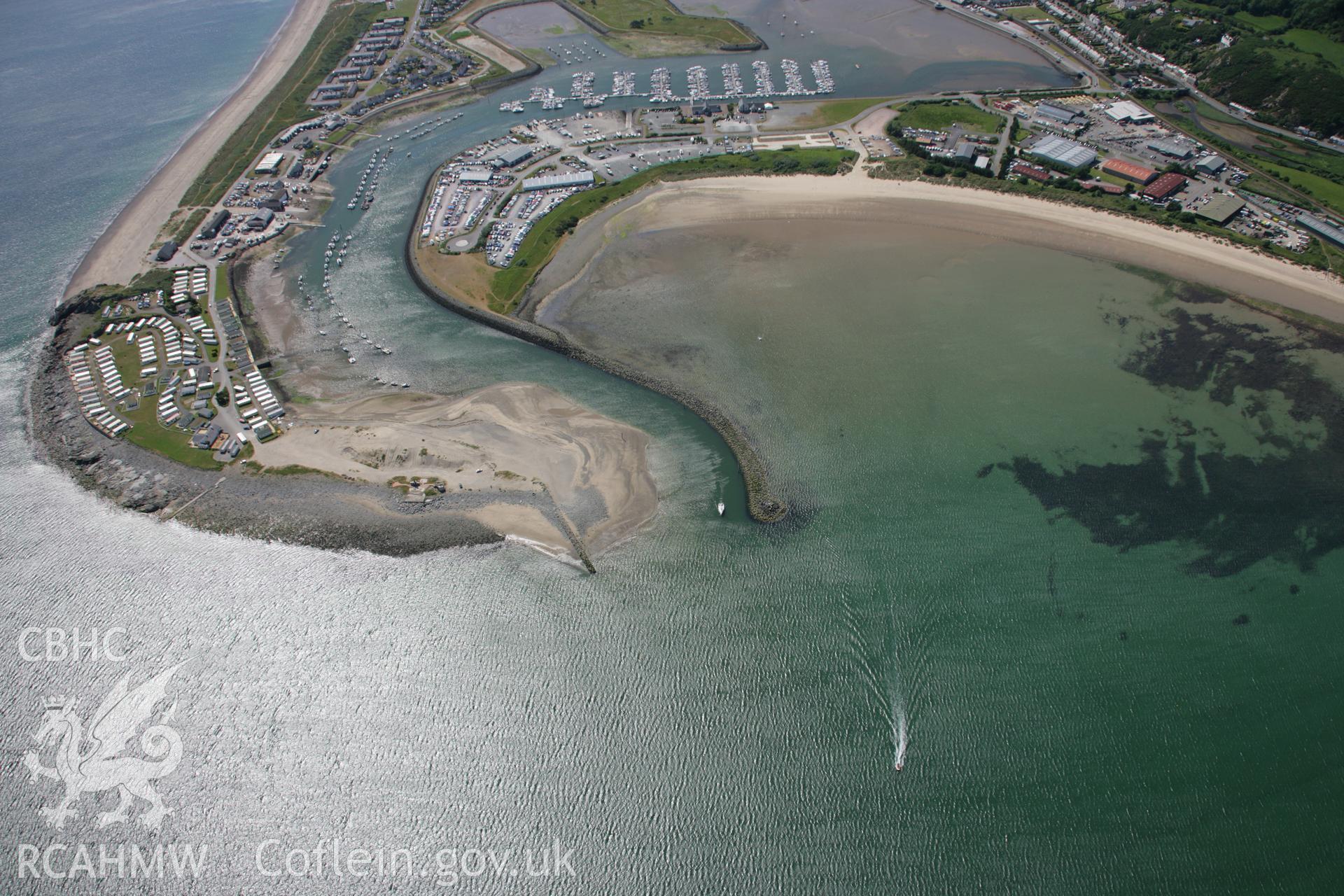 RCAHMW colour oblique aerial photograph of Pwllheli Harbour looking west. Taken on 14 June 2006 by Toby Driver.
