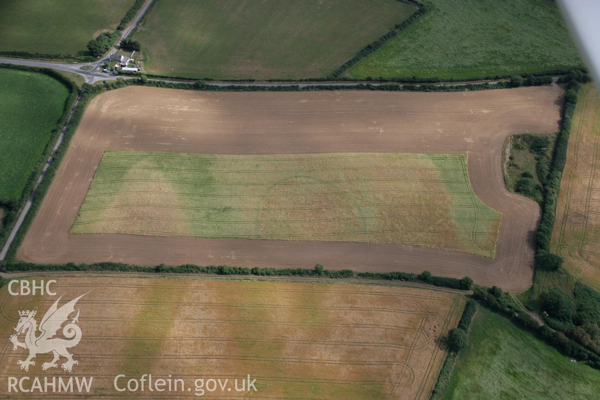 RCAHMW colour oblique aerial photograph of the Post-Coch cropmark enclosure northeast of Nevern. Taken on 27 July 2006 by Toby Driver.