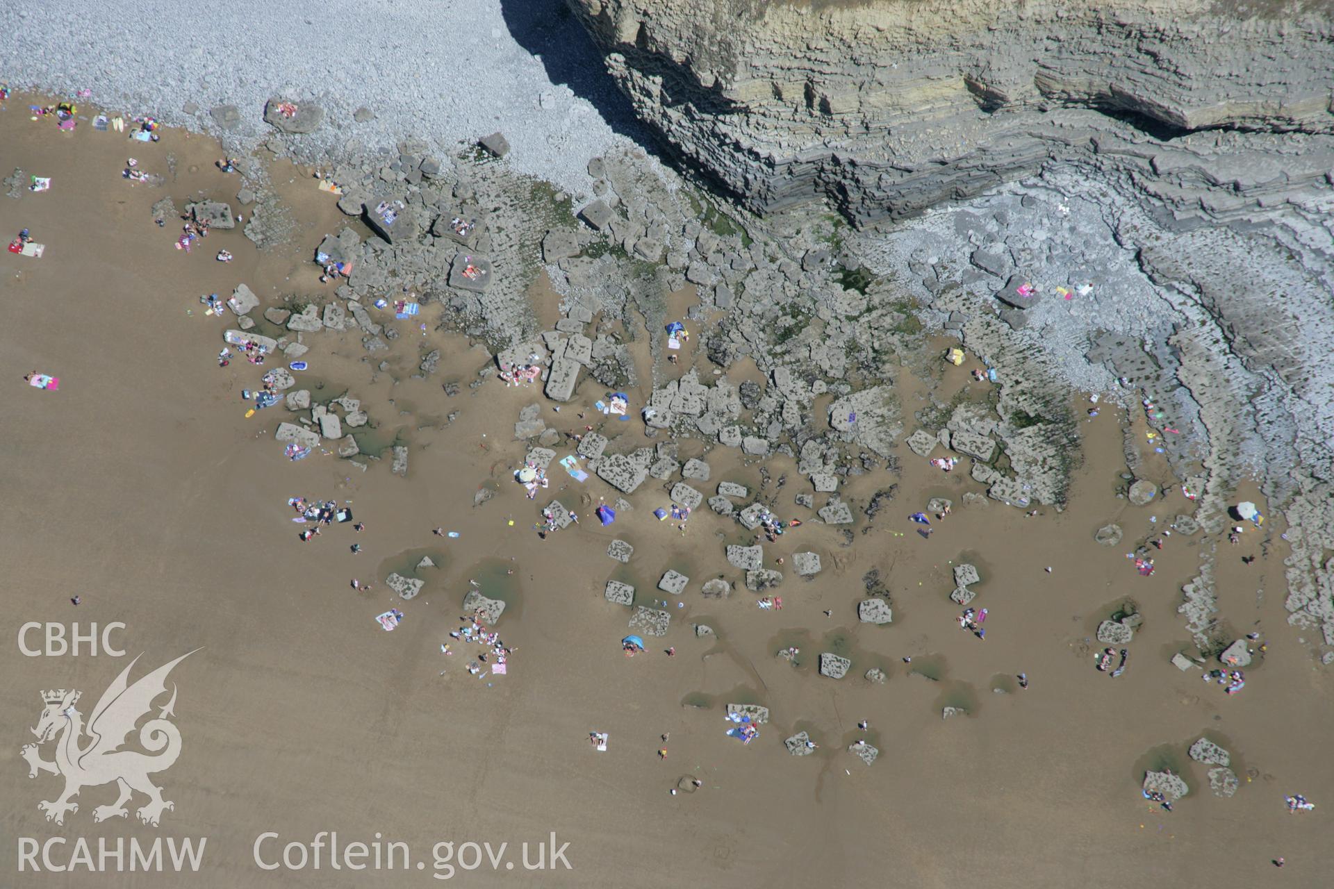 RCAHMW colour oblique aerial photograph of Dunraven Hillfort, and the 'dancing stones' below the fort. Taken on 24 July 2006 by Toby Driver.