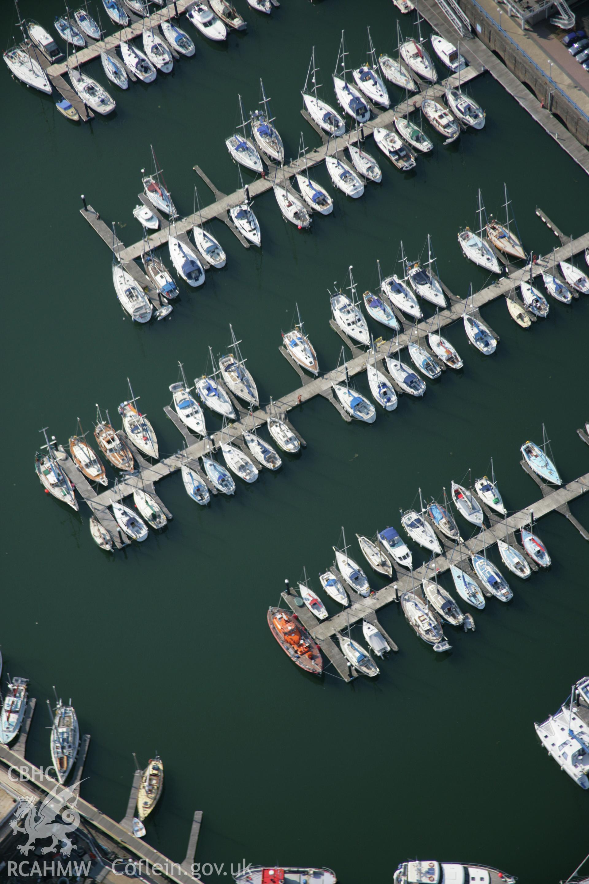 RCAHMW colour oblique aerial photograph of Milford Haven Dockyard, with view of marina from the south-east. Taken on 08 June 2006 by Toby Driver.