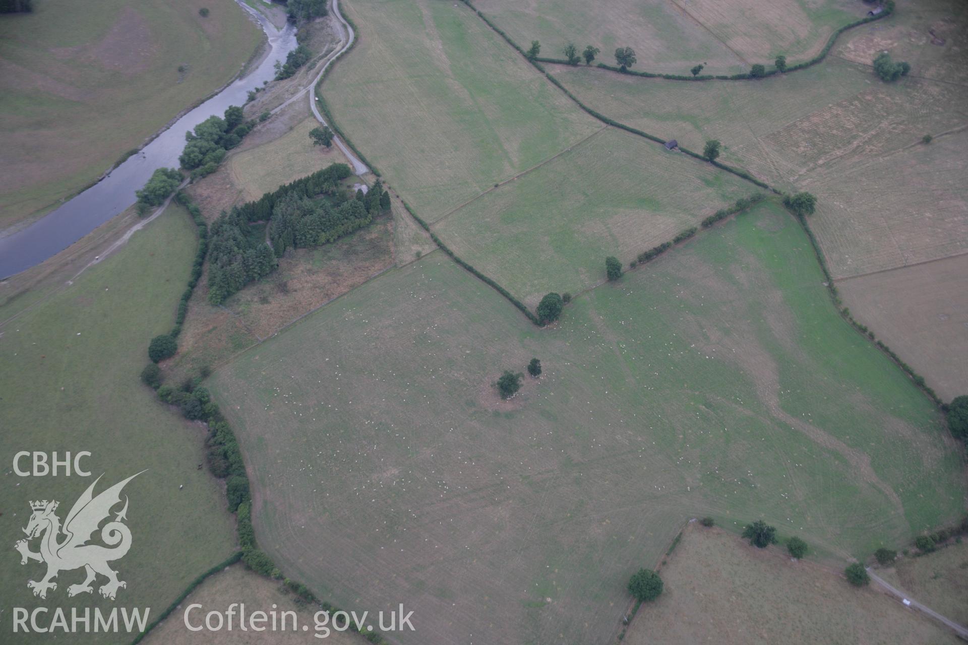 RCAHMW colour oblique aerial photograph showing parchmarks in grass at Llwyn-y-Brain Roman Fort. Taken on 14 August 2006 by Toby Driver.