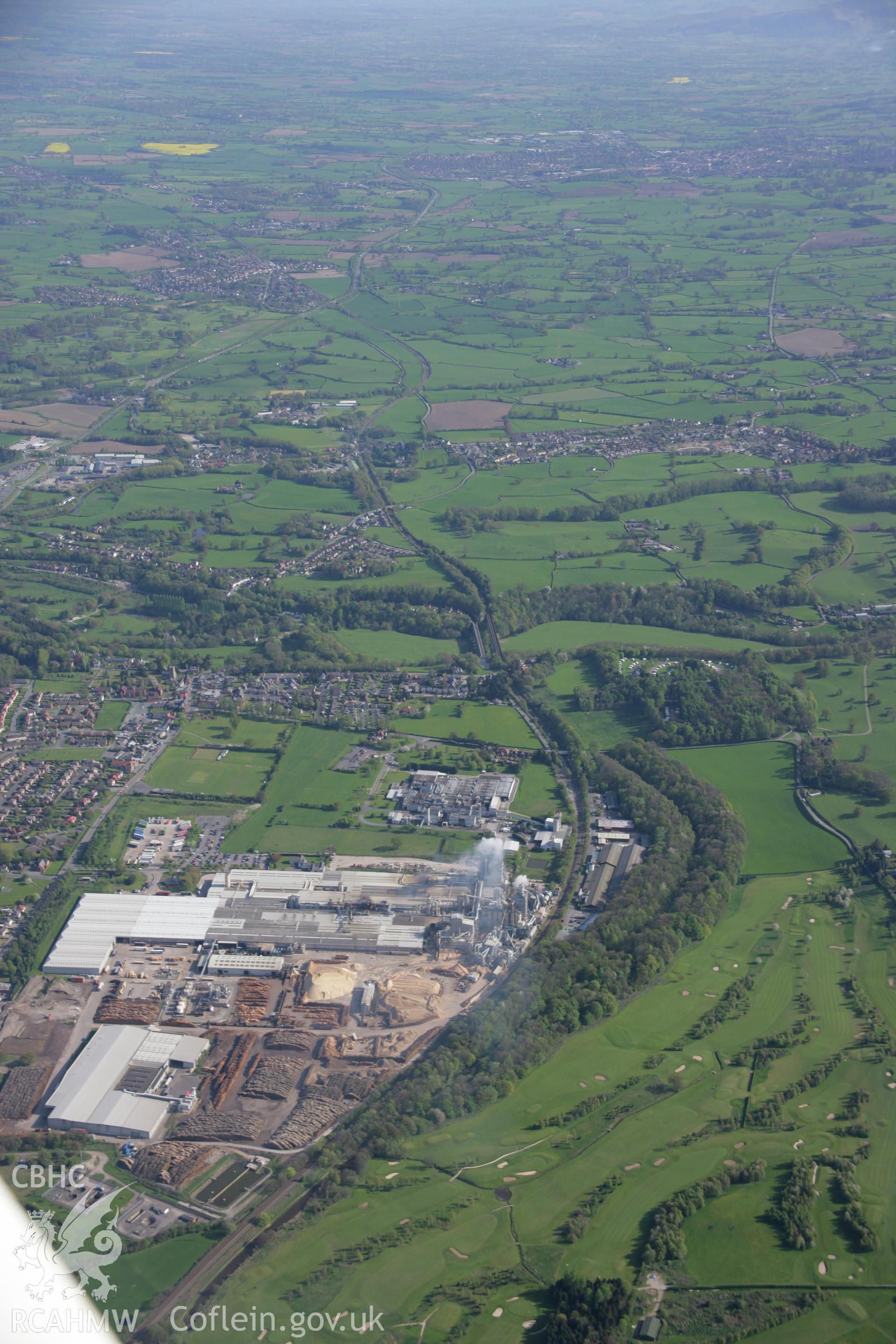 RCAHMW digital colour oblique photograph of the woodchip factory in Chirk from the north. Taken on 05/05/2006 by T.G. Driver.