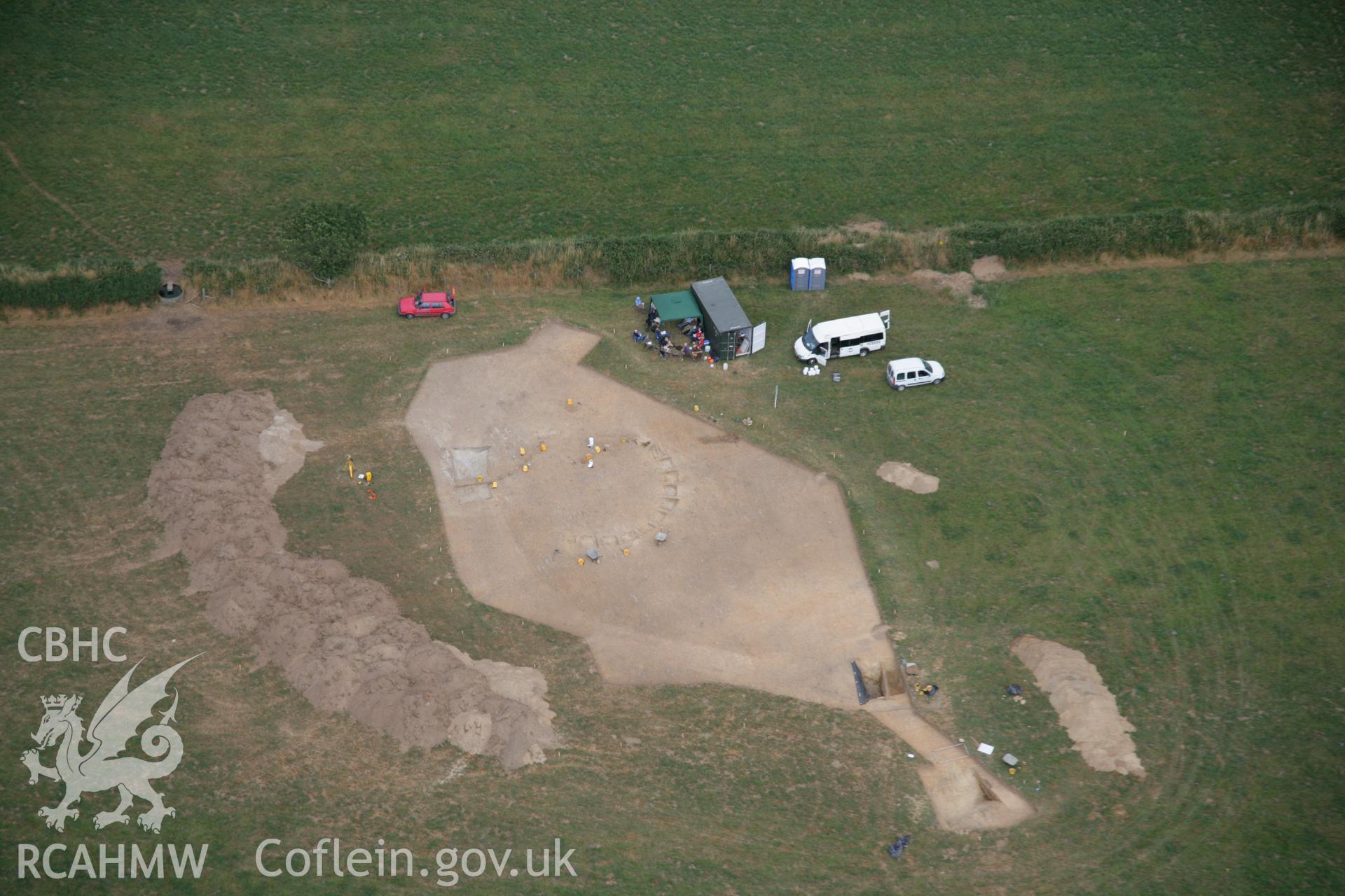 RCAHMW colour oblique aerial photograph of Ffynnonwen Defended Enclosure during excavations by the Dyfed Archaeological Trust. Taken on 27 July 2006 by Toby Driver.
