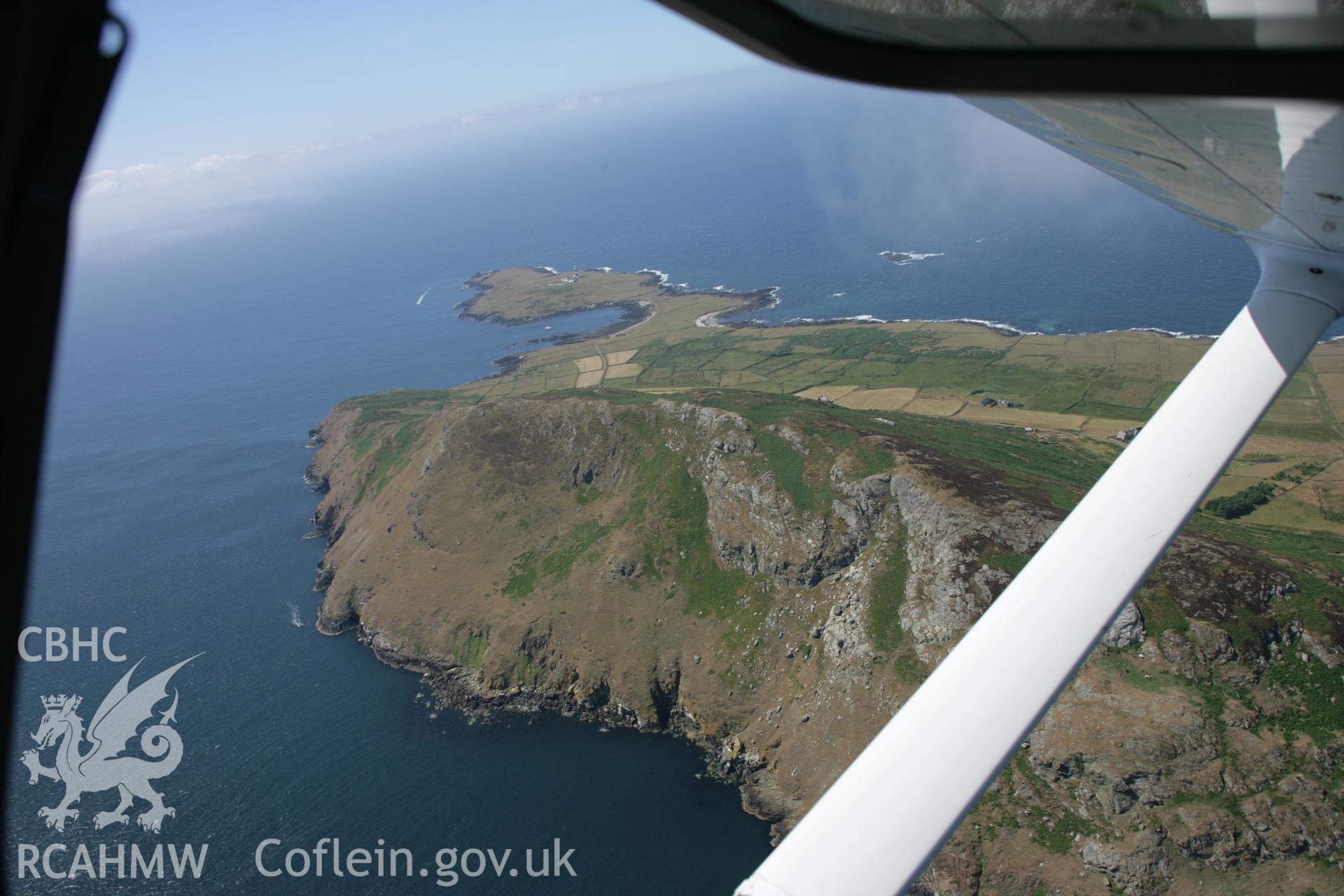 RCAHMW colour oblique aerial photograph of Bardsey Island (Ynys Enlli) showing the eastern cliffs and Mynydd Enlli from the north-east. Taken on 03 August 2006 by Toby Driver.