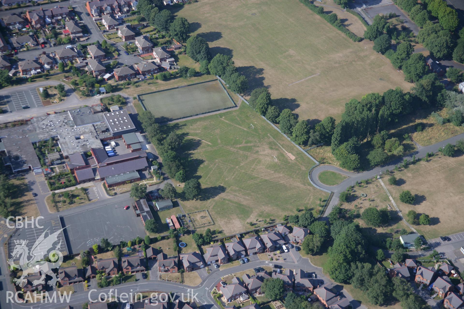 RCAHMW colour oblique aerial photograph of cropmarks of Former Barracks at Hightown. Taken on 17 July 2006 by Toby Driver.