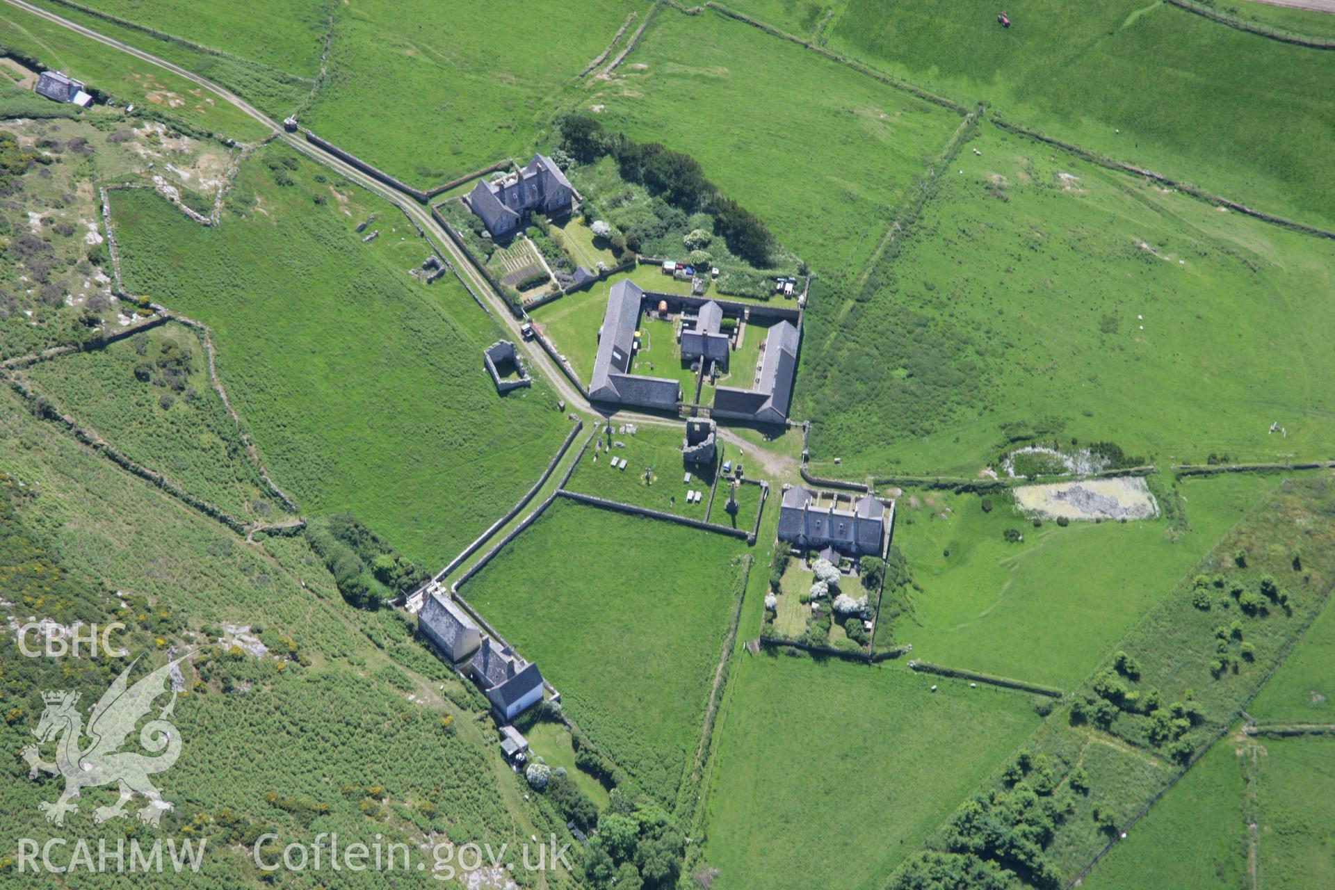 RCAHMW colour oblique aerial photograph of St Mary's Abbey, Bardsey Island, from the north-east. Taken on 14 June 2006 by Toby Driver.