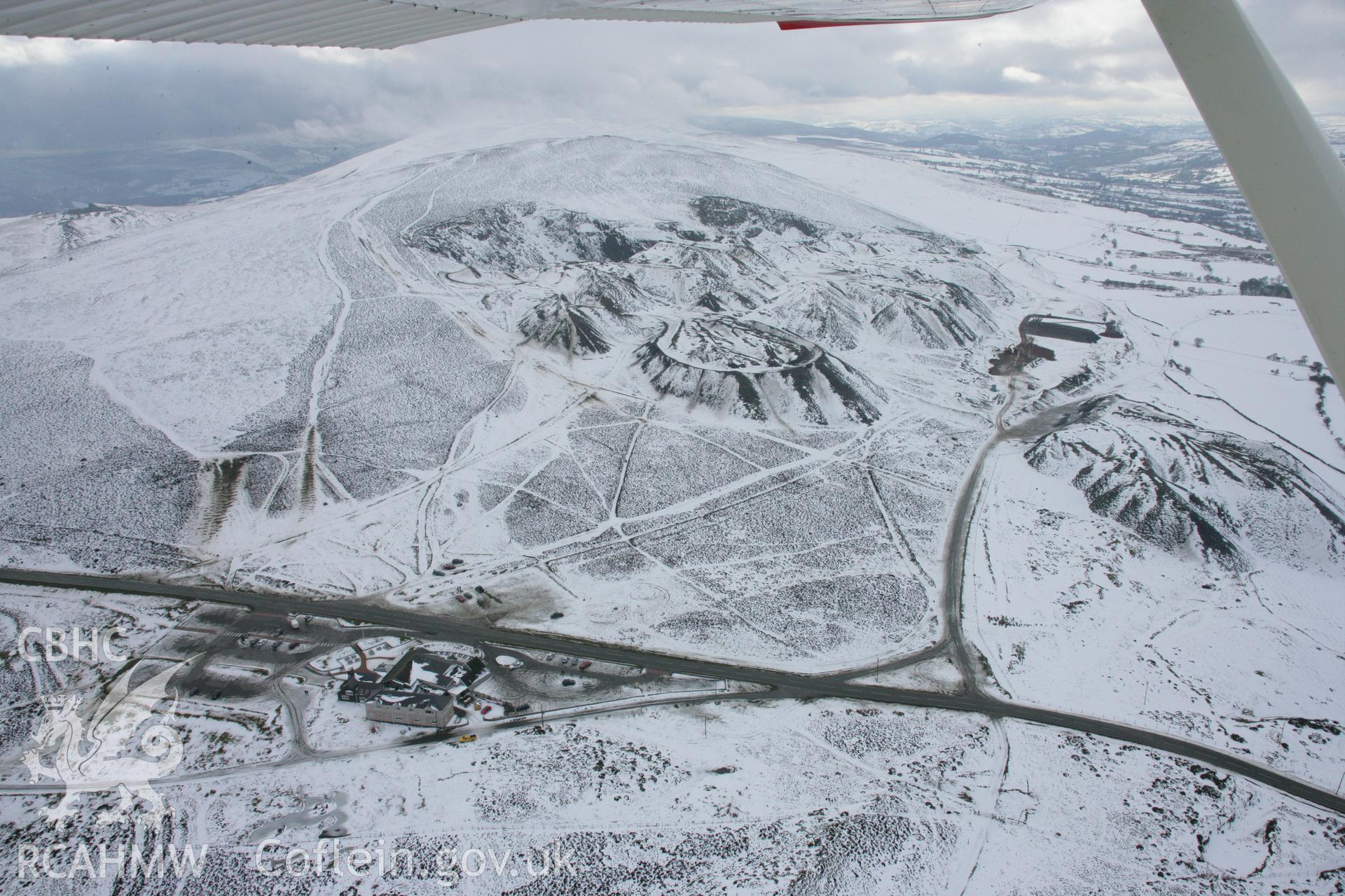 RCAHMW colour oblique aerial photograph of Moel-y-Faen Slate Quarries, under snow viewed from the east. Taken on 06 March 2006 by Toby Driver.