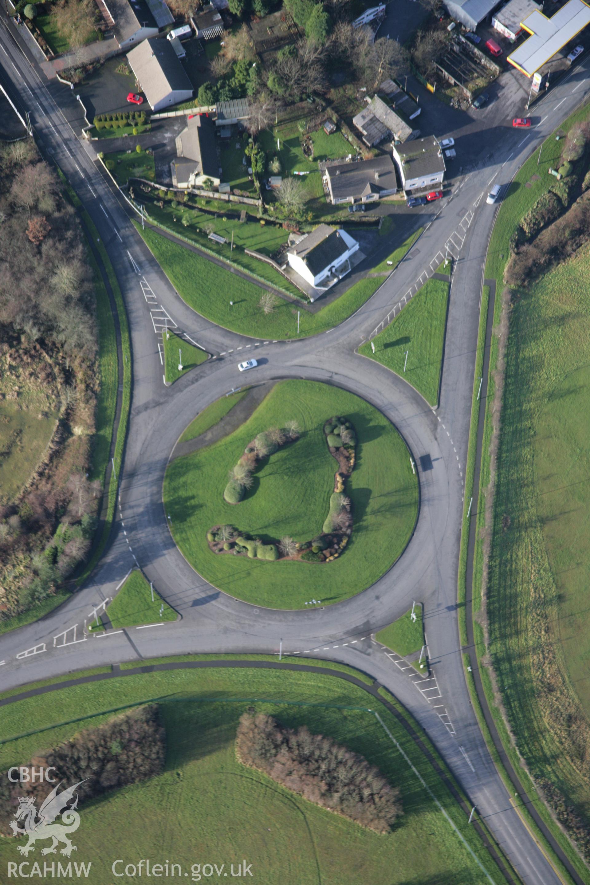 RCAHMW colour oblique aerial photograph of Begelly. A view of the roundabout in village from south-east Taken on 11 January 2006 by Toby Driver.