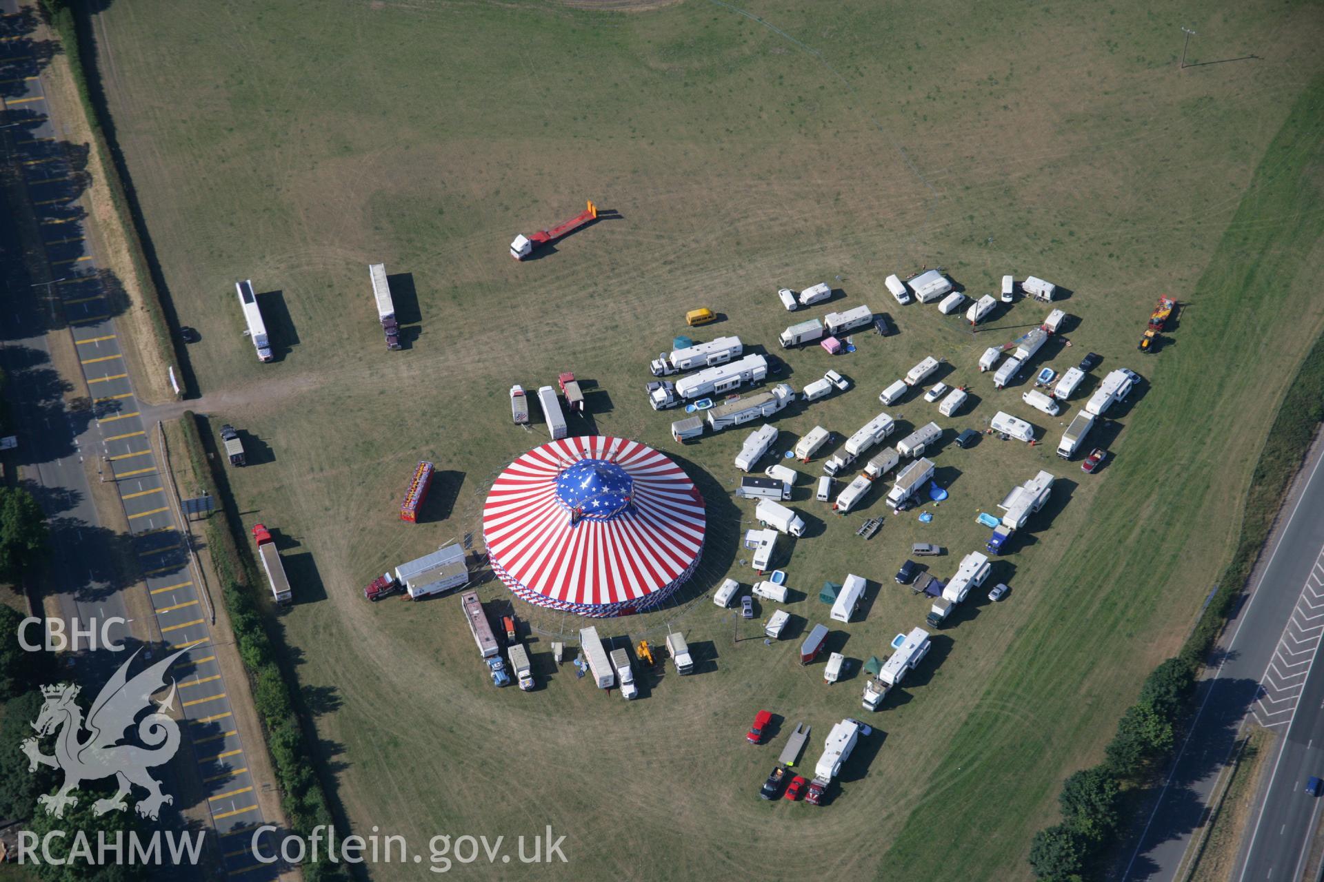 RCAHMW colour oblique aerial photograph of Wrexham showing the American fair. Taken on 17 July 2006 by Toby Driver.