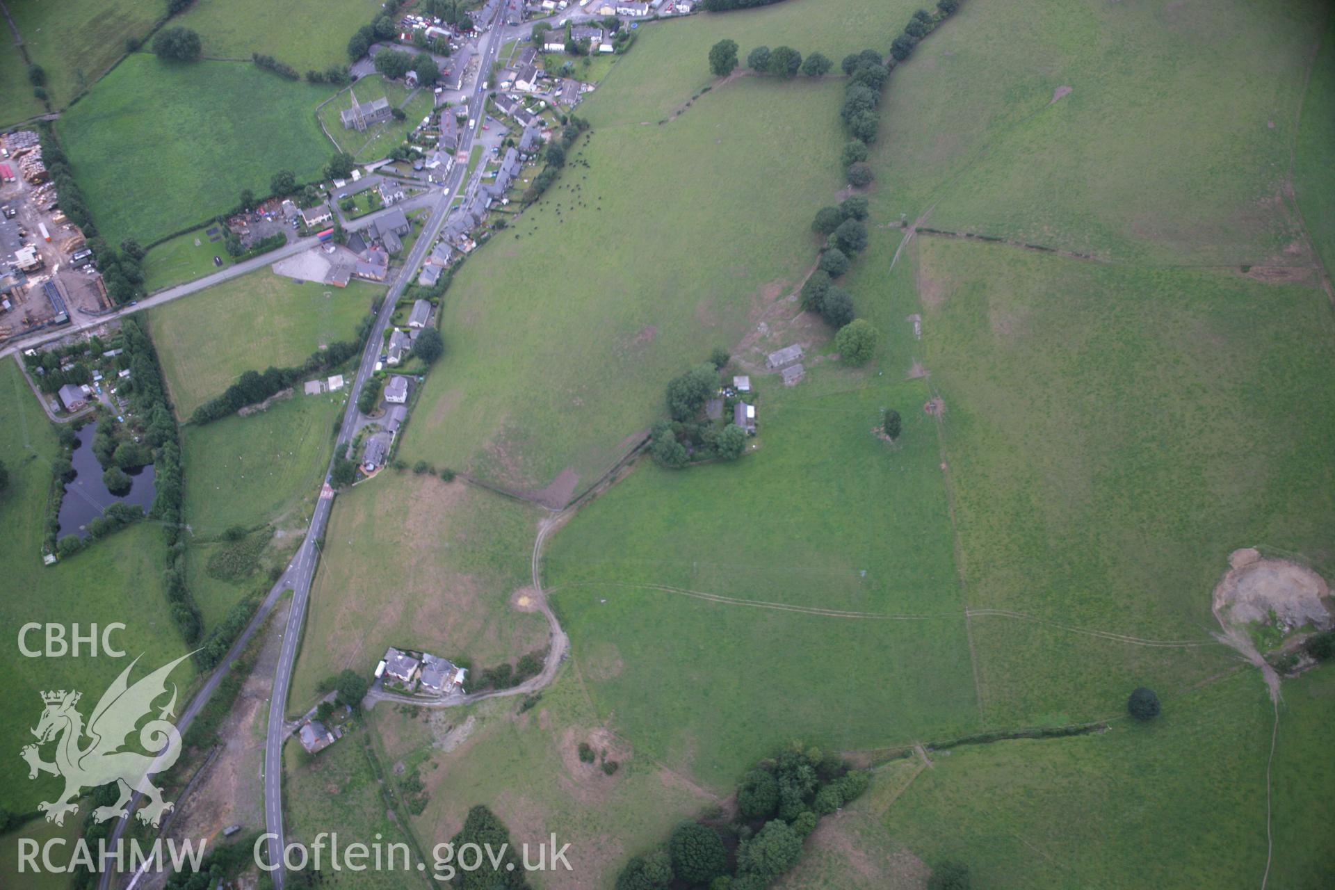RCAHMW colour oblique aerial photograph of Methodist Wesleyan Chapel, Gwyddelwern, with possible Roman road parchmarks. Taken on 14 August 2006 by Toby Driver