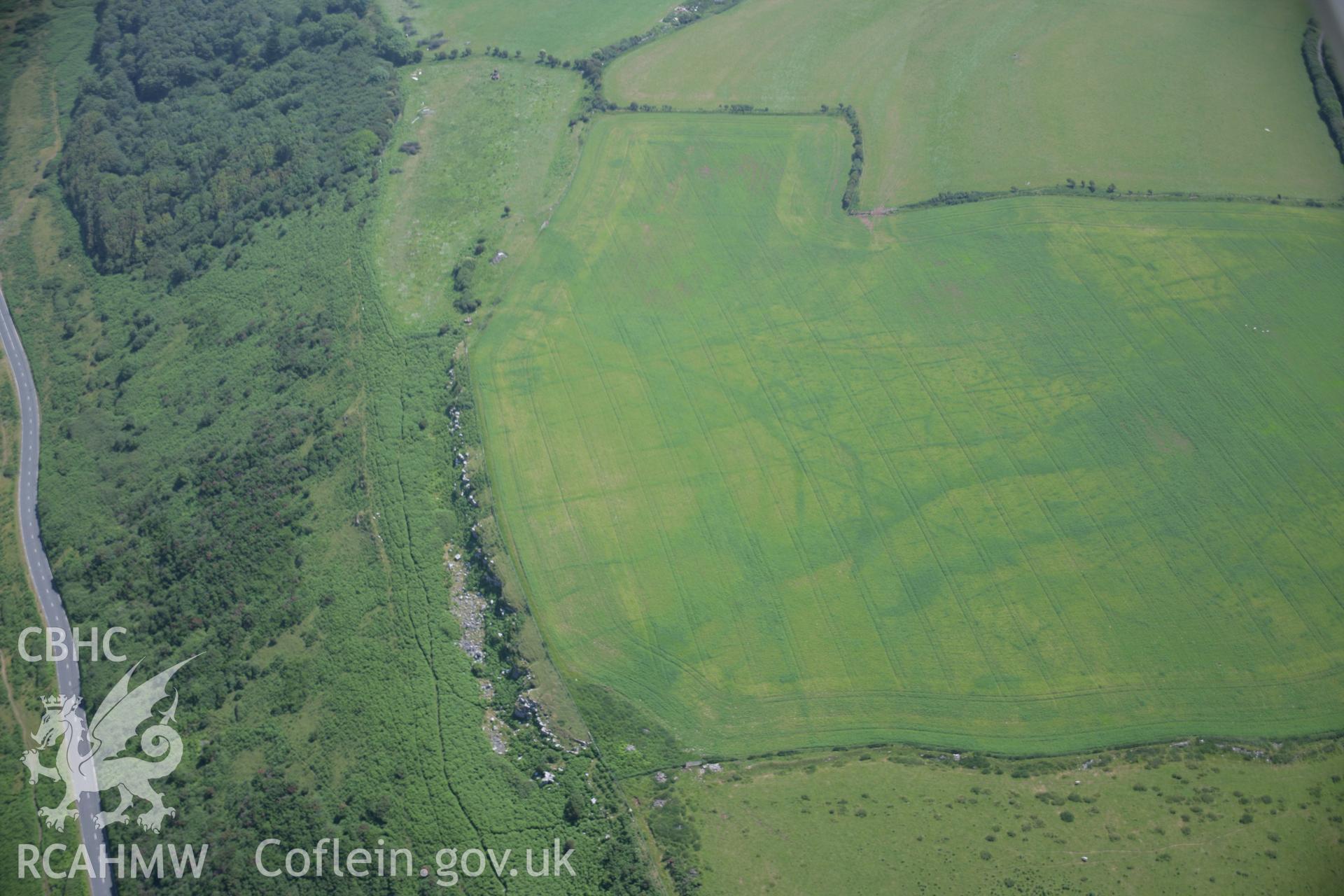 RCAHMW colour oblique photograph of Norton west enclosure. Taken by Toby Driver on 29/06/2006.