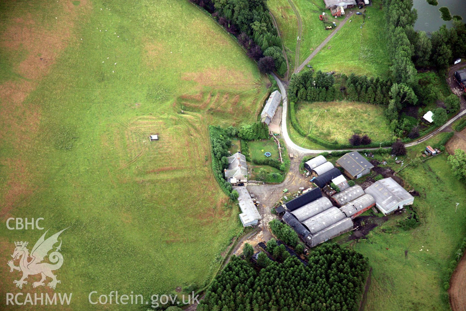 RCAHMW colour oblique aerial photograph of Llwydiarth Hall, Llanfihangel Yng Ngwynfa showing turf maze and garden earthworks. Taken on 31 July 2006 by Toby Driver.