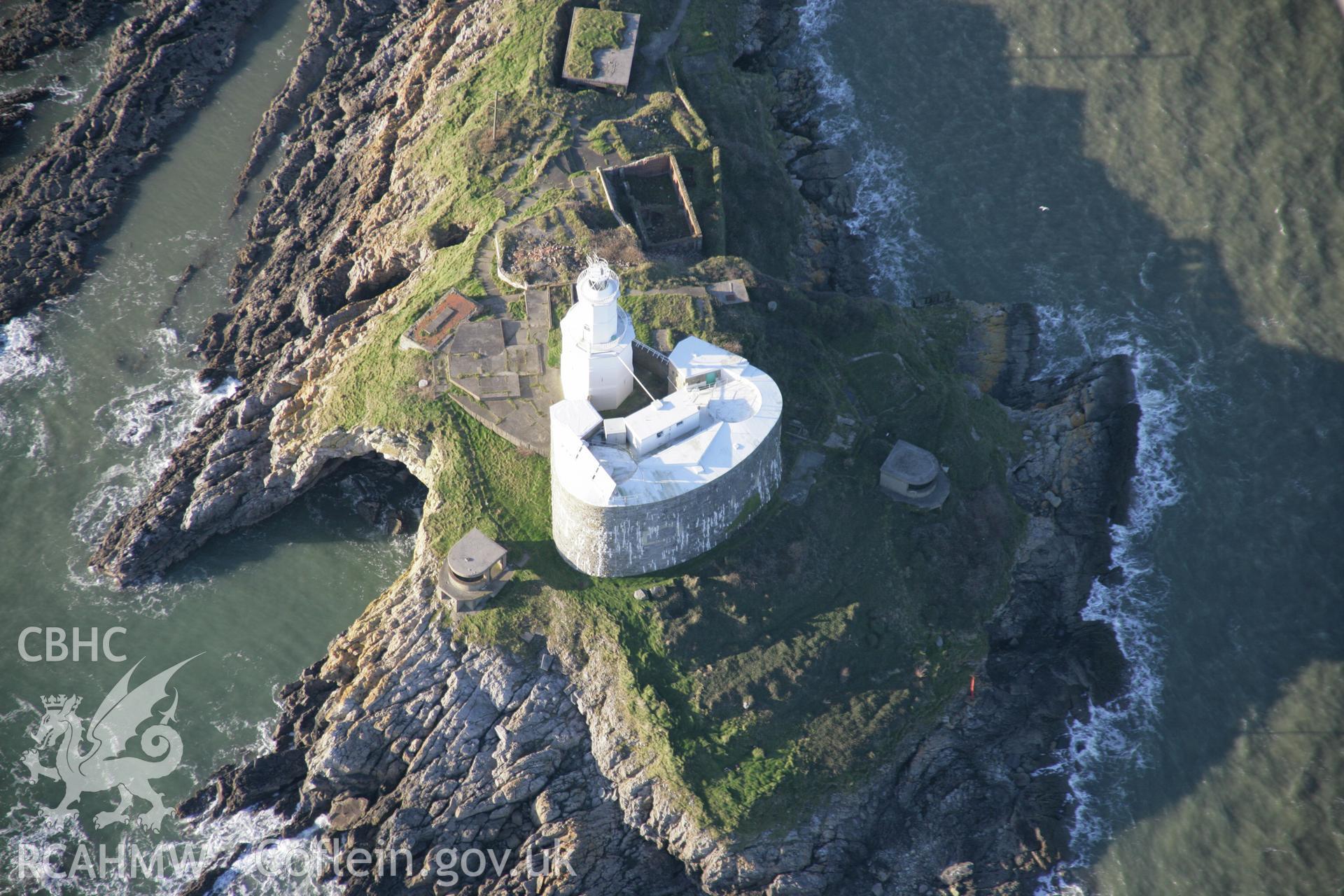RCAHMW colour oblique aerial photograph of Mumbles Lighthouse, viewed from the east. Taken on 26 January 2006 by Toby Driver.