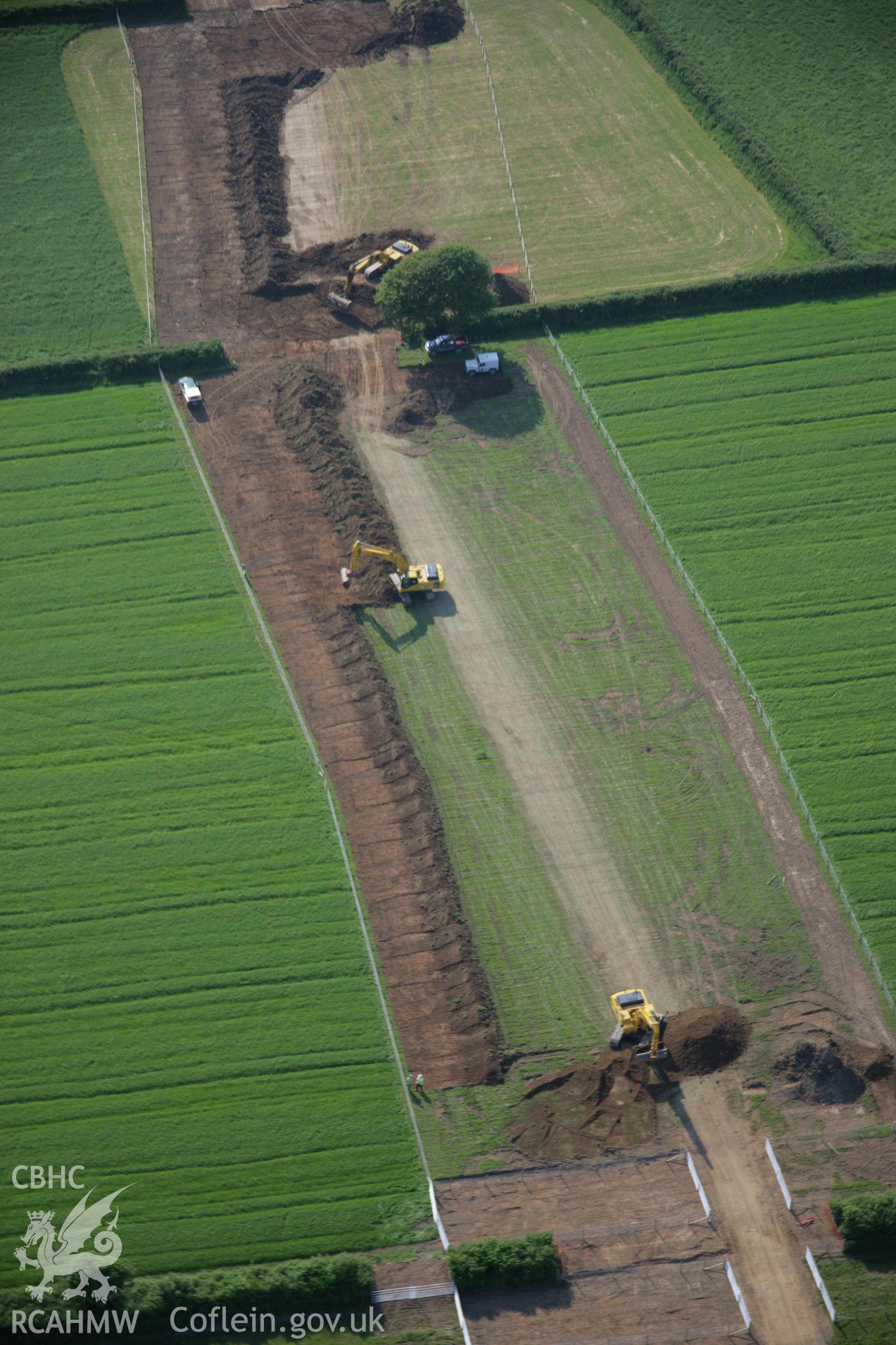 RCAHMW colour oblique aerial photograph of LNG Natural Gas Pipeline, under construction at Tavernspite, viewed looking to the west. Taken on 08 June 2006 by Toby Driver