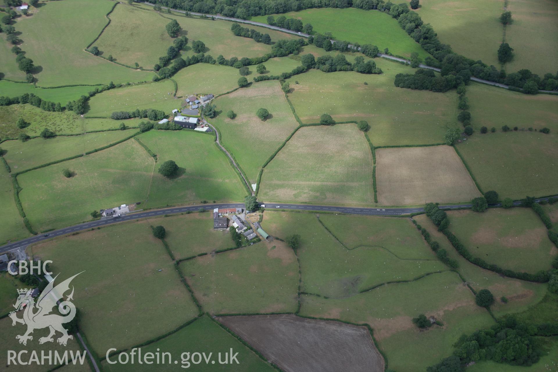 RCAHMW colour oblique aerial photograph of the Roman road between Four Crosses and Druid at Bryncoch. Taken on 31 July 2006 by Toby Driver.