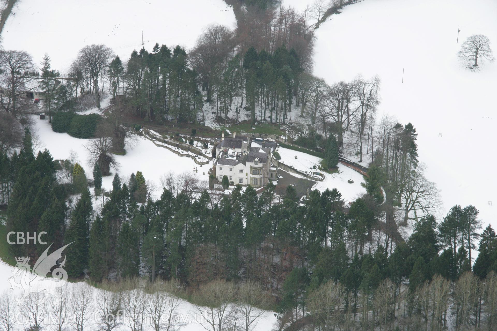 RCAHMW colour oblique aerial photograph of Gelli-Gynan Hall, Llanarmon-yn-Ial. A view from the east under snow. Taken on 06 March 2006 by Toby Driver.