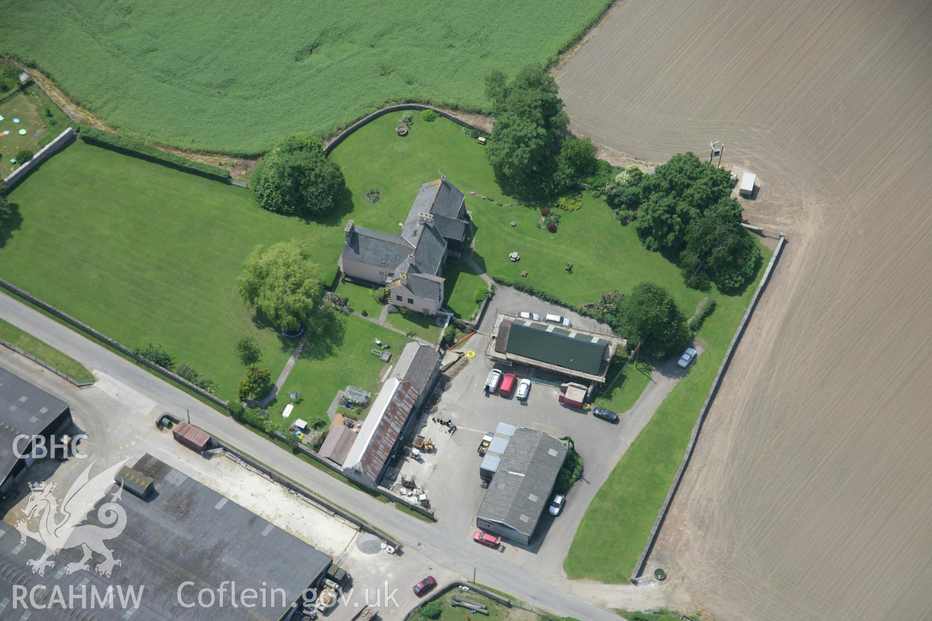 RCAHMW colour oblique aerial photograph of Trostrey Court from the north-east. Taken on 09 June 2006 by Toby Driver.
