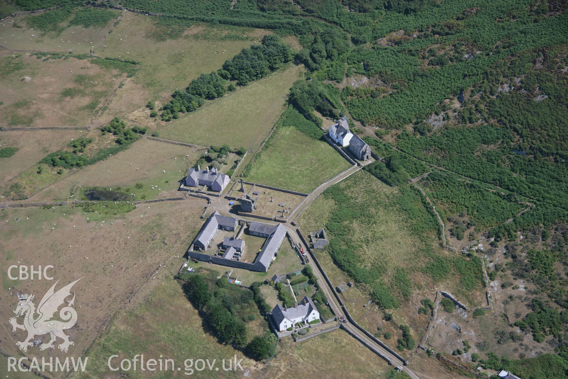 RCAHMW colour oblique aerial photograph of St Mary's Abbey, Bardsey Island, from the south-west. Taken on 03 August 2006 by Toby Driver.
