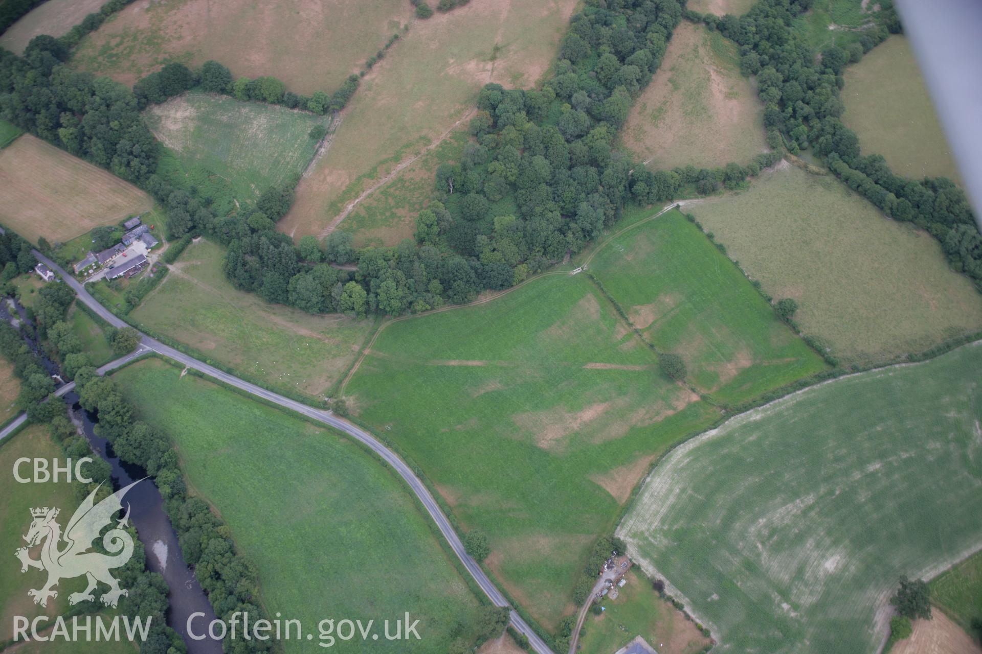 RCAHMW colour oblique aerial photograph of Sarn Helen Roman Road Earthwork, Dolauhirion. Taken on 27 July 2006 by Toby Driver.