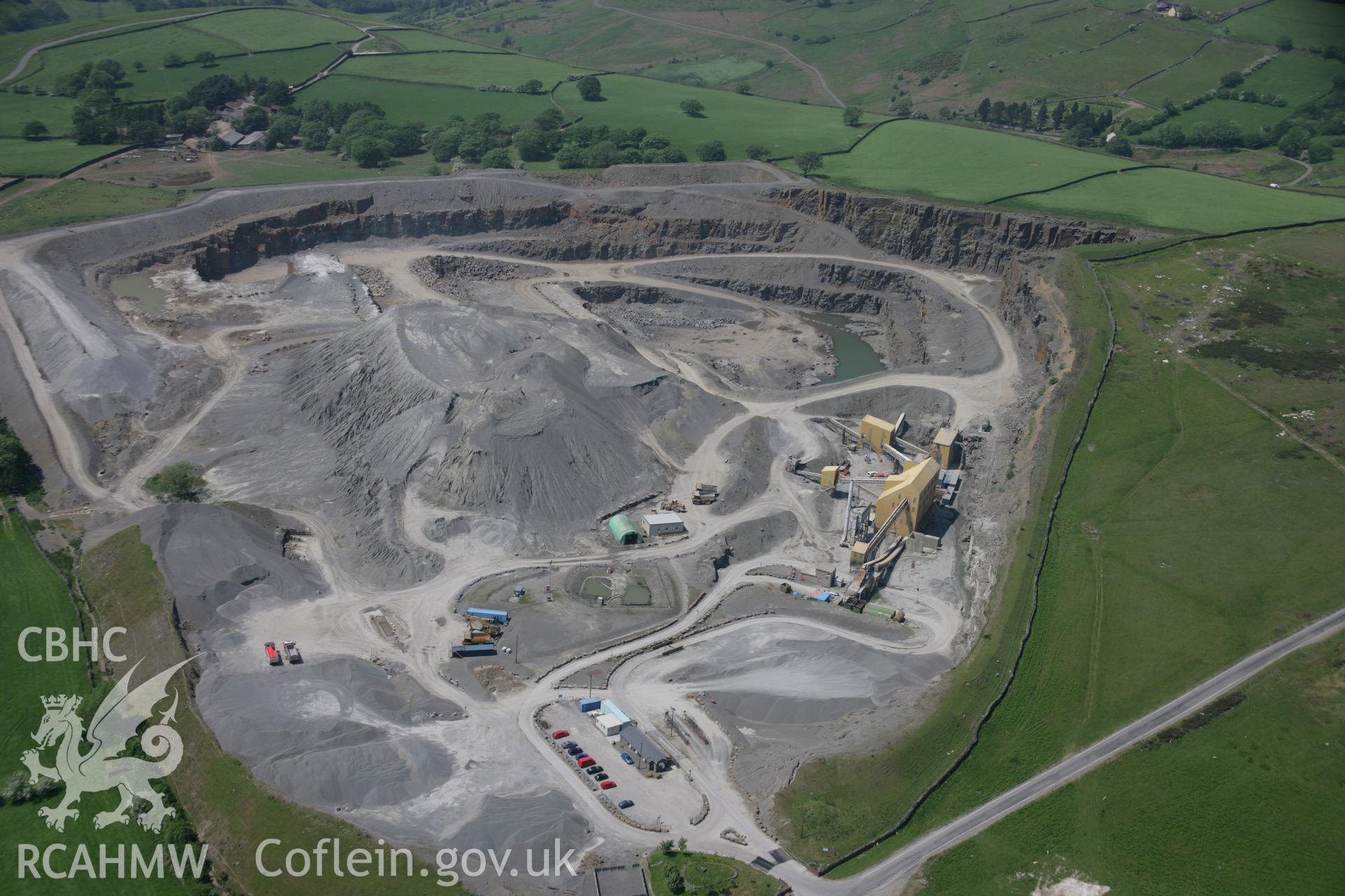 RCAHMW colour oblique aerial photograph of Gelligaer Quarry. Taken on 09 June 2006 by Toby Driver
