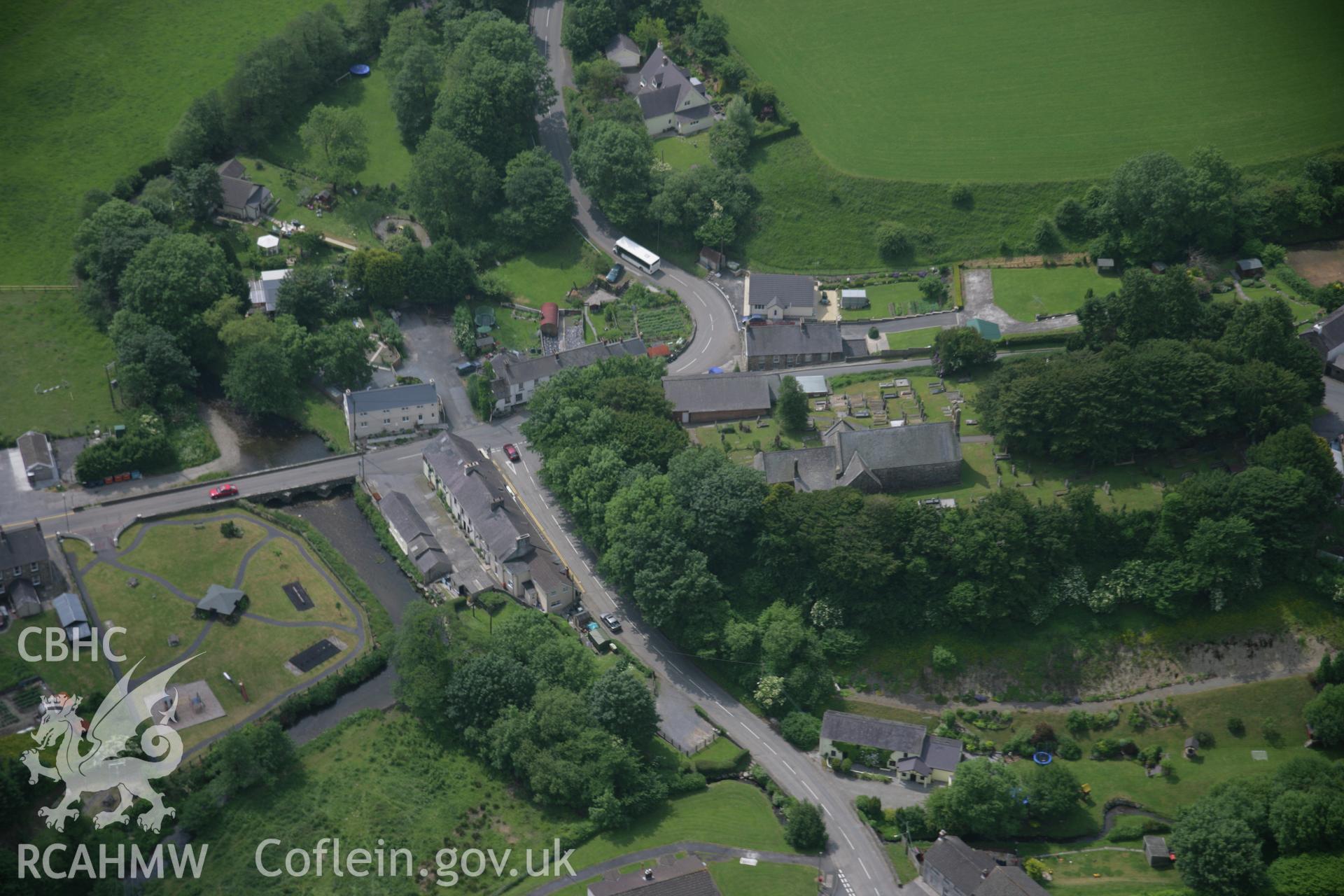 RCAHMW colour oblique aerial photograph of Meidrim village, with St Davids Church, viewed from the north. Taken on 15 June 2006 by Toby Driver