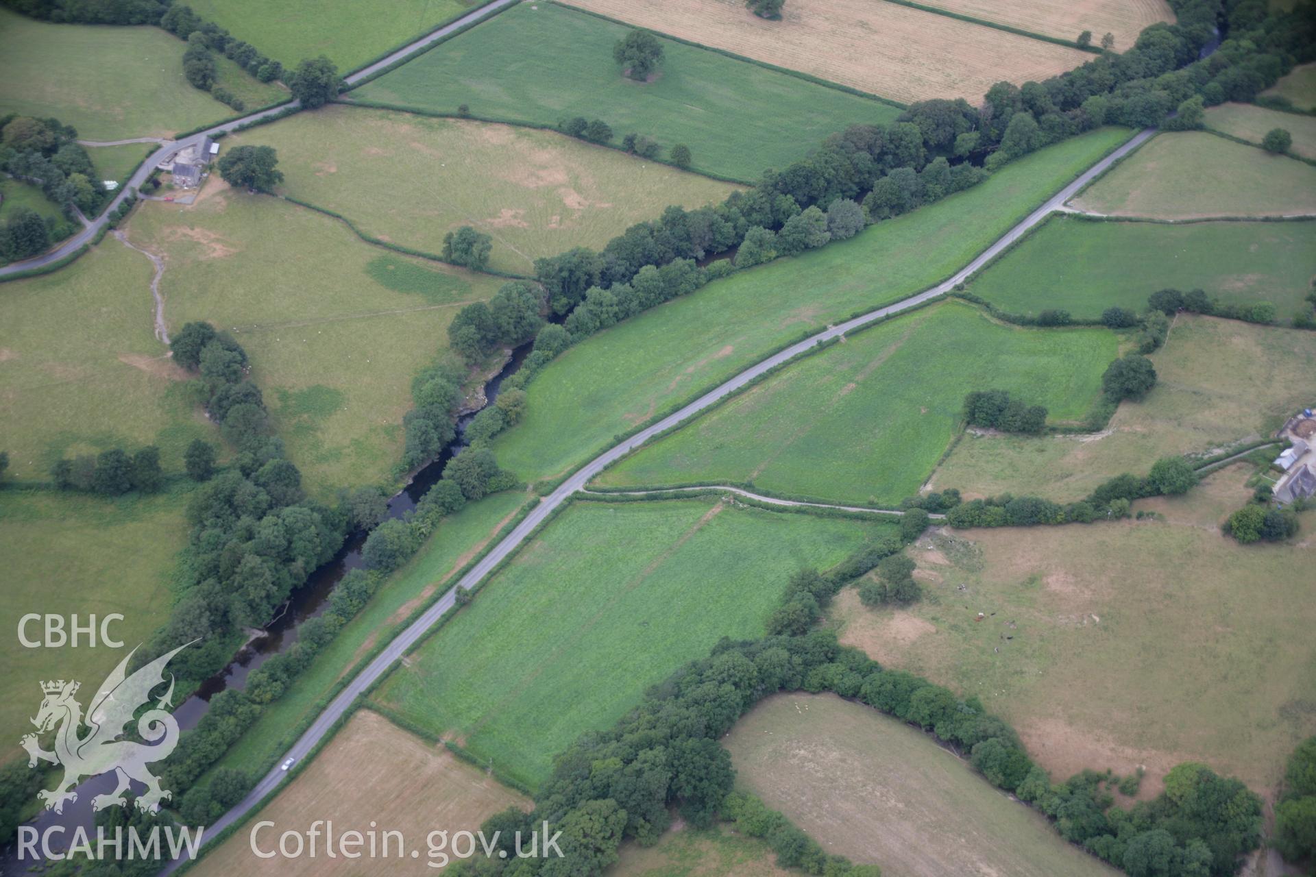 RCAHMW colour oblique aerial photograph of Sarn Helen Roman Road Earthwork, Dolauhirion. Taken on 27 July 2006 by Toby Driver.