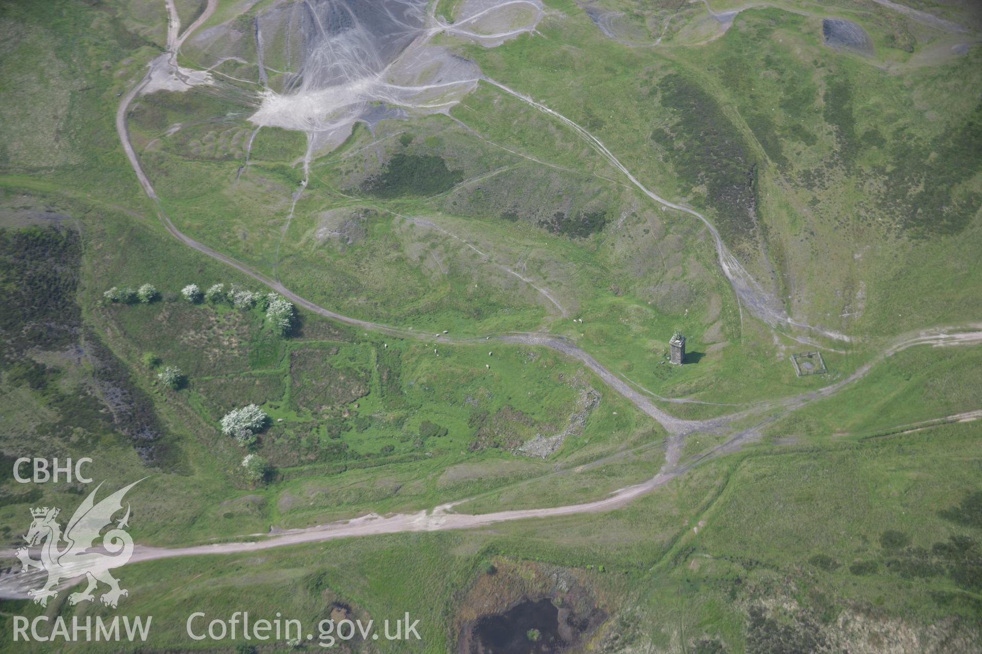 RCAHMW colour oblique aerial photograph of the boiler stack base at Hill Pits from the north-east. Taken on 09 June 2006 by Toby Driver.