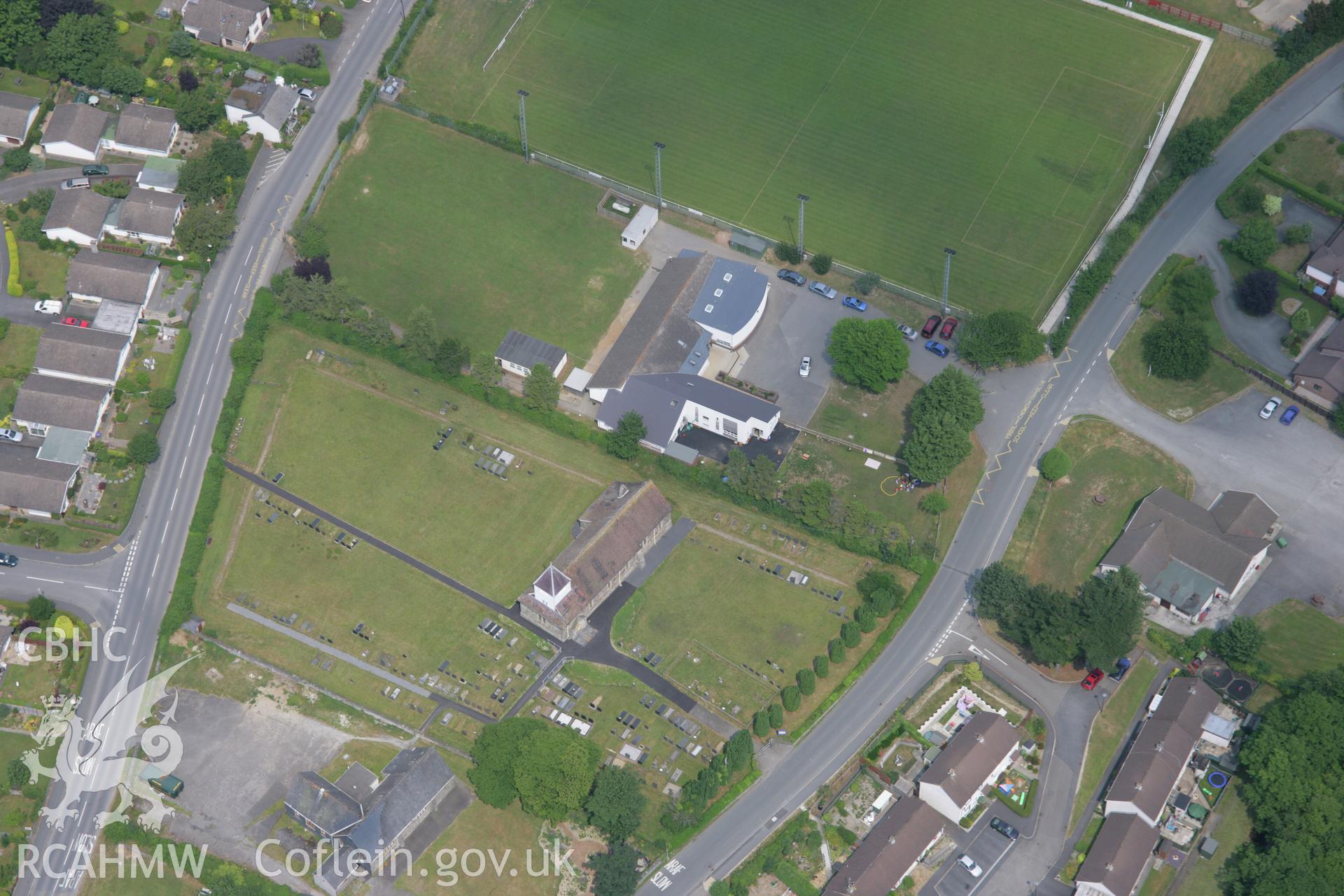 RCAHMW colour oblique aerial photograph of St John's Church, Penrhyncoch. Taken on 04 July 2006 by Toby Driver