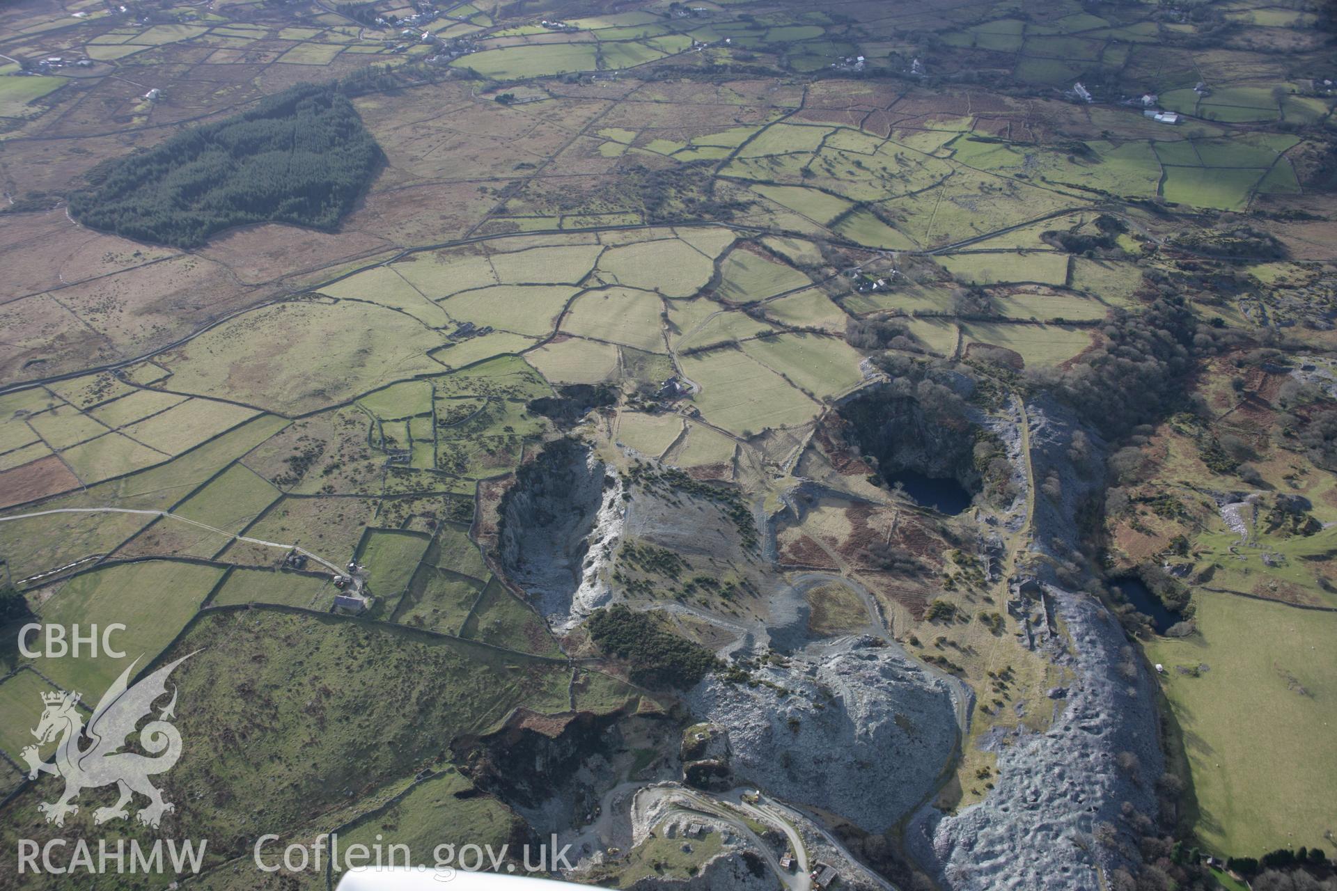 RCAHMW colour oblique aerial photograph of Vronheulog Slate Quarry and nearby field systems from the north-east. Taken on 09 February 2006 by Toby Driver.