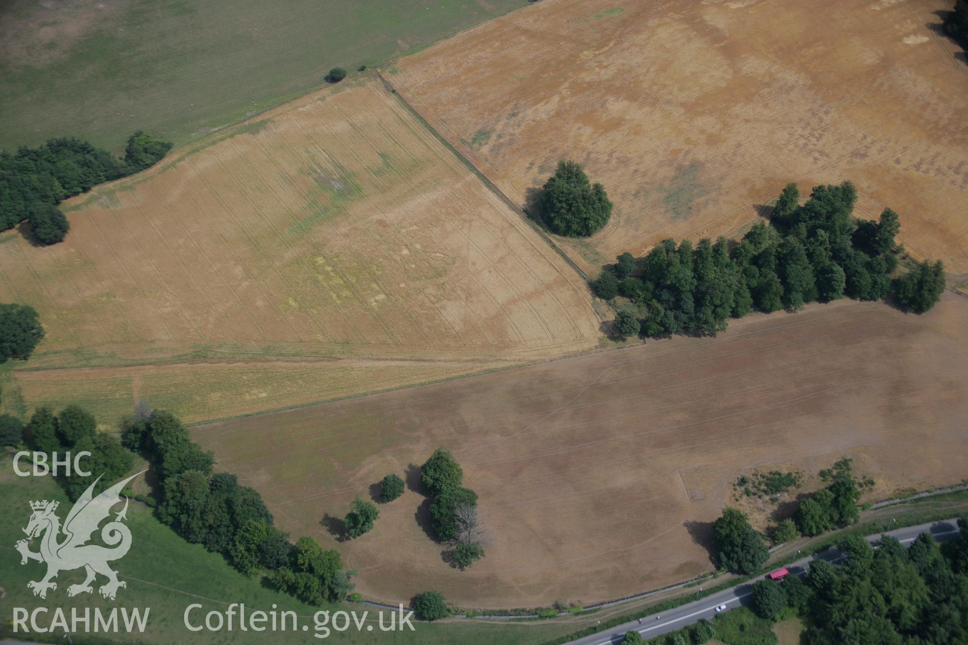 RCAHMW colour oblique aerial photograph of cropmarks near Llandegai Henge Monuments and Cursus. Taken on 25 July 2006 by Toby Driver.