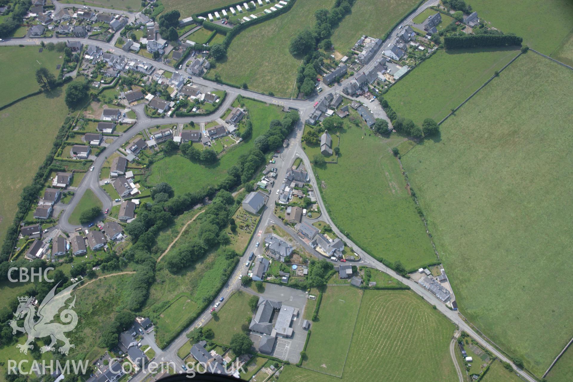 RCAHMW colour oblique aerial photograph of Bryn Crug Chapel and village. Taken on 04 July 2006 by Toby Driver.