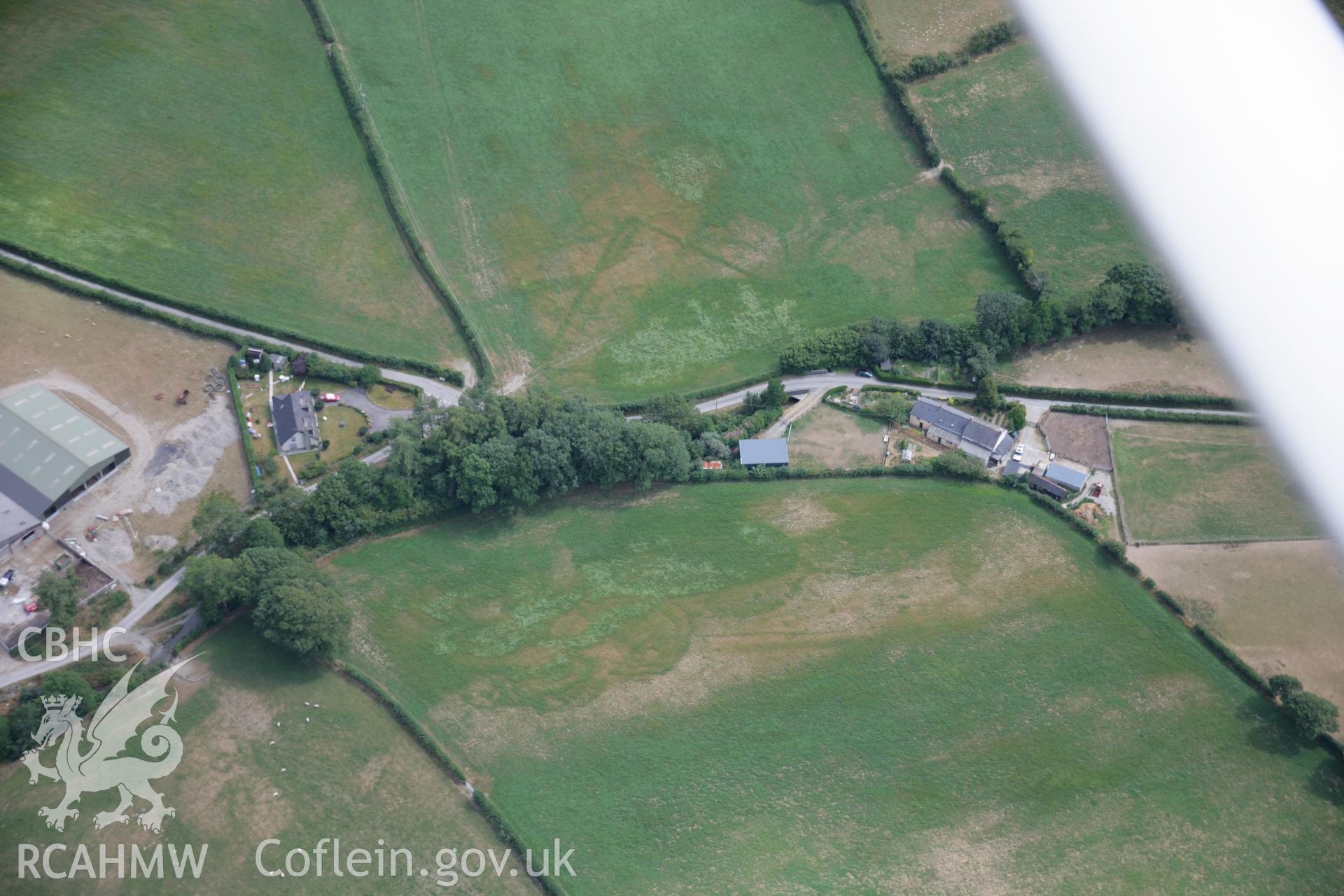 RCAHMW colour oblique aerial photograph of the cropmarks at Cyncoed that possibly represent an enclosure.. Taken on 27 July 2006 by Toby Driver.