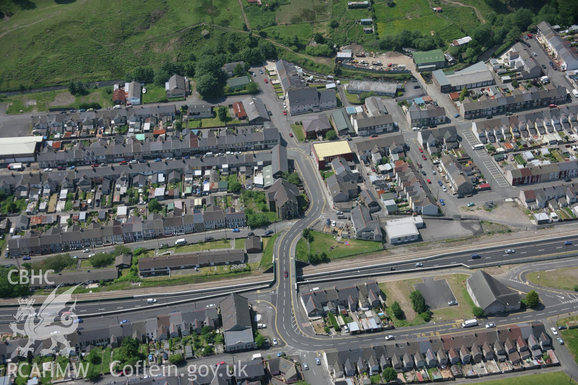 RCAHMW colour oblique aerial photograph of Cwm Village from the north-east. Taken on 09 June 2006 by Toby Driver.