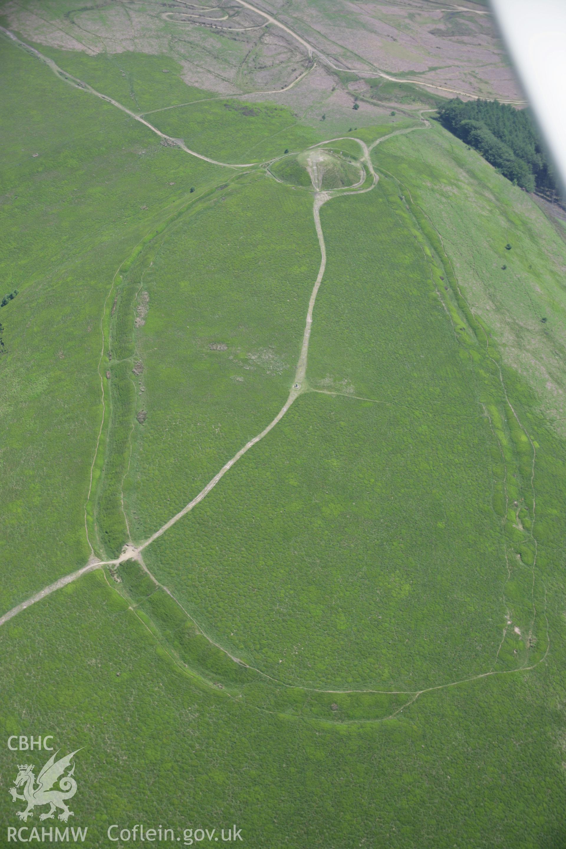 RCAHMW colour oblique aerial photograph of Twmbarlwm Castle and possible hillfort from the west. Taken on 09 June 2006 by Toby Driver.