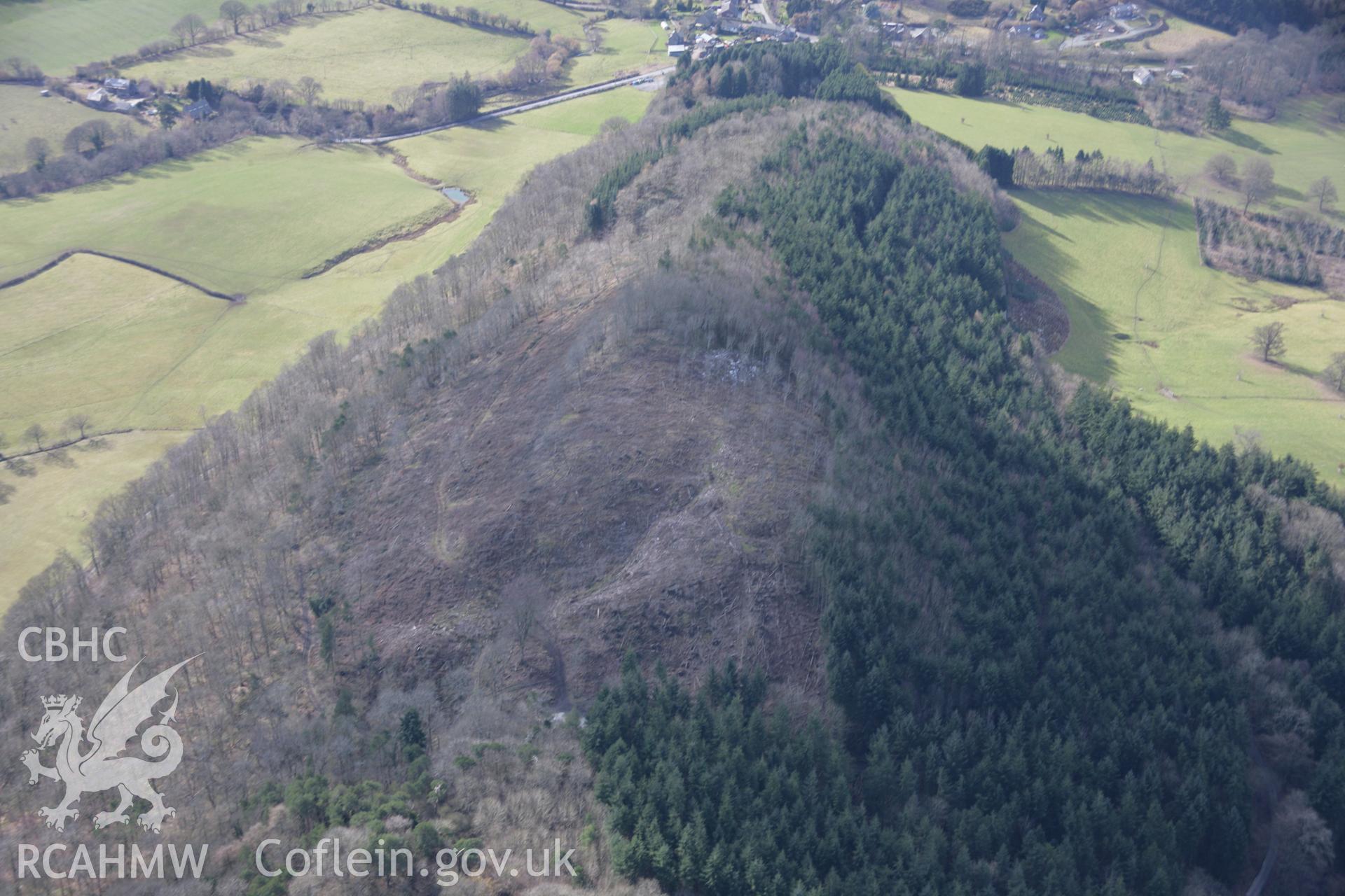RCAHMW colour oblique aerial photograph of Bryngwyn Wood Camp from the north-east. Taken on 06 March 2006 by Toby Driver.