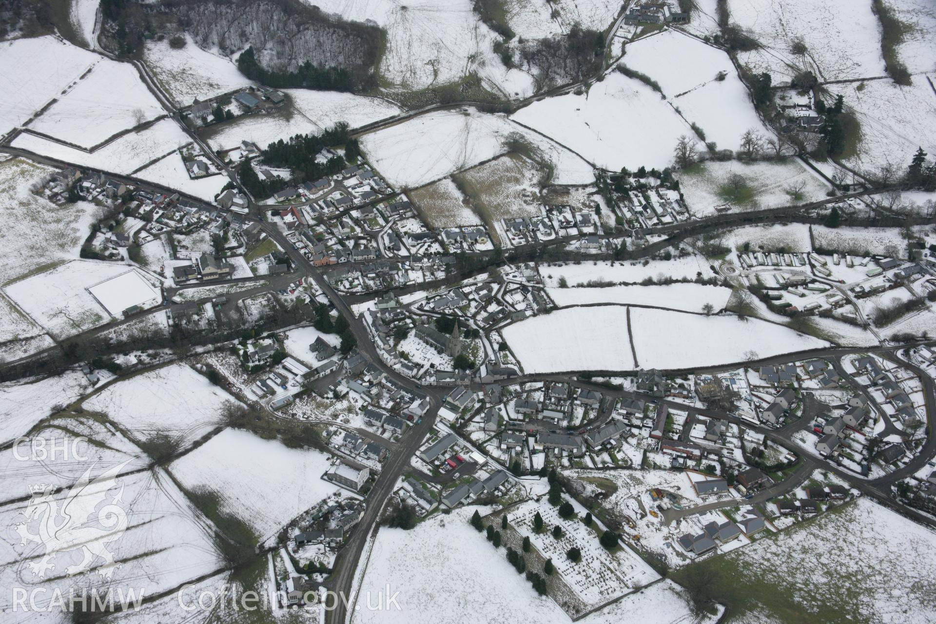 RCAHMW colour oblique aerial photograph of Llandrillo viewed from the west with snow. Taken on 06 March 2006 by Toby Driver.