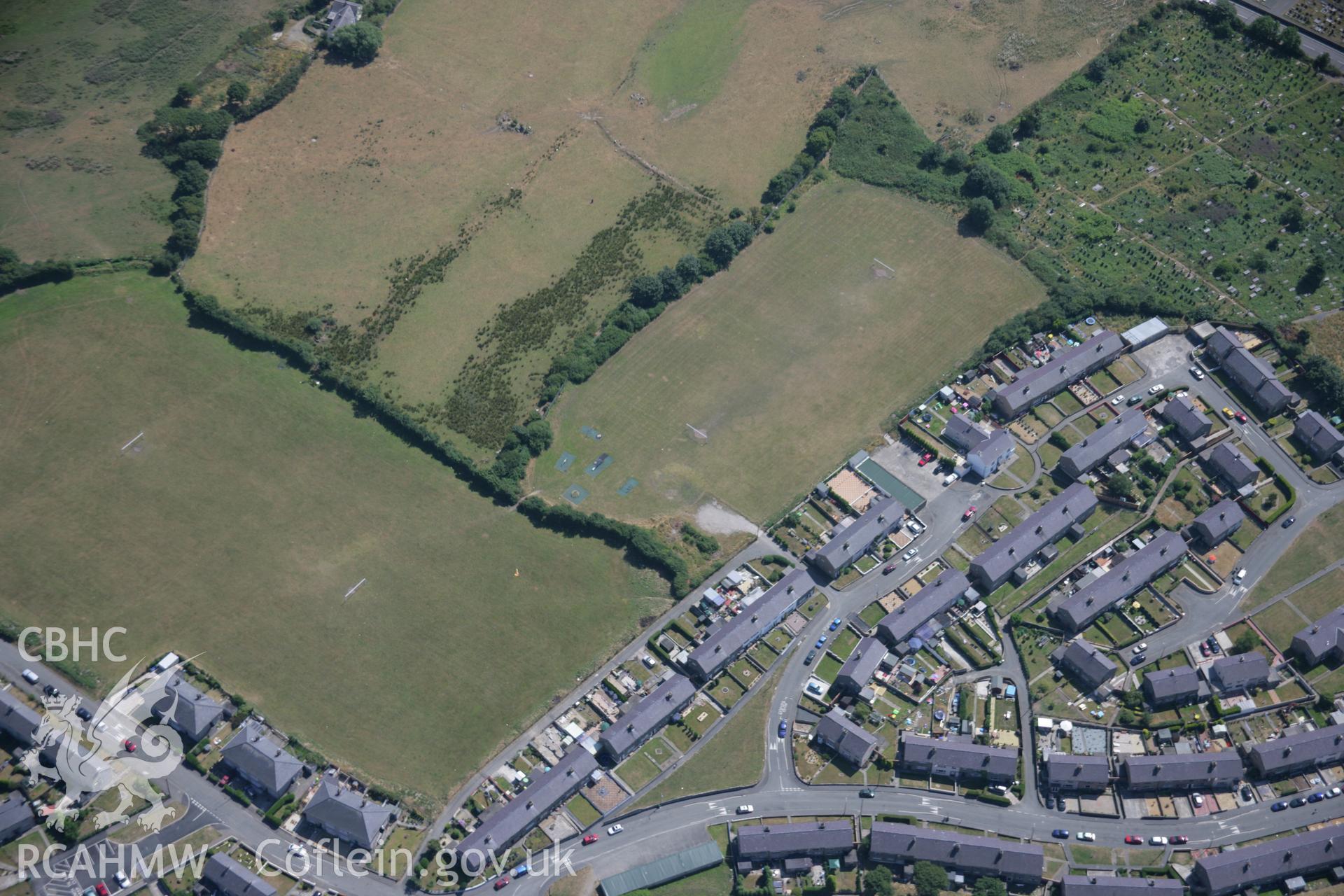 RCAHMW colour oblique aerial photograph of the Tyddyn Pandy Square Barrow Cemetery. Taken on 25 July 2006 by Toby Driver.