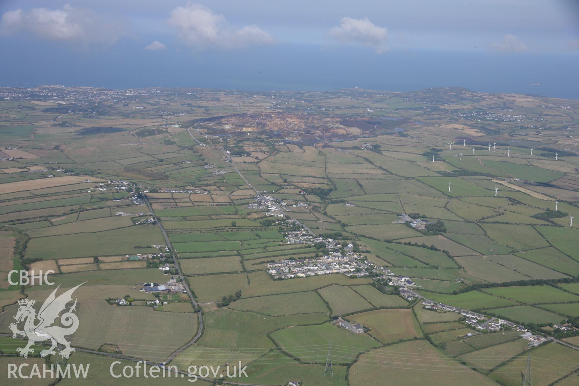 RCAHMW colour oblique aerial photograph of Christ Church in landscape view of Rhosybol. Taken on 14 August 2006 by Toby Driver