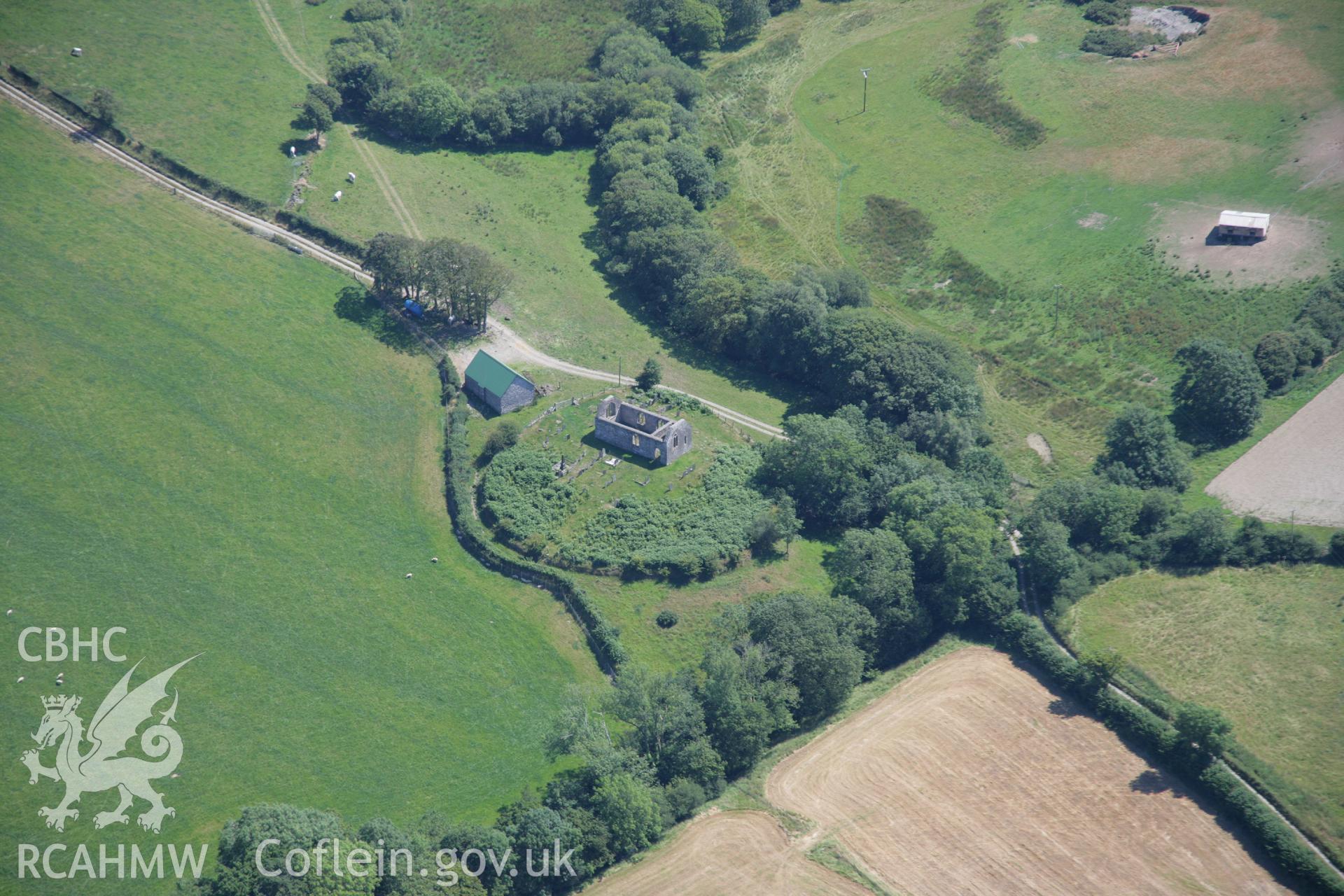 RCAHMW colour oblique aerial photograph of St Michael's Church, Rhostie. Taken on 17 July 2006 by Toby Driver.