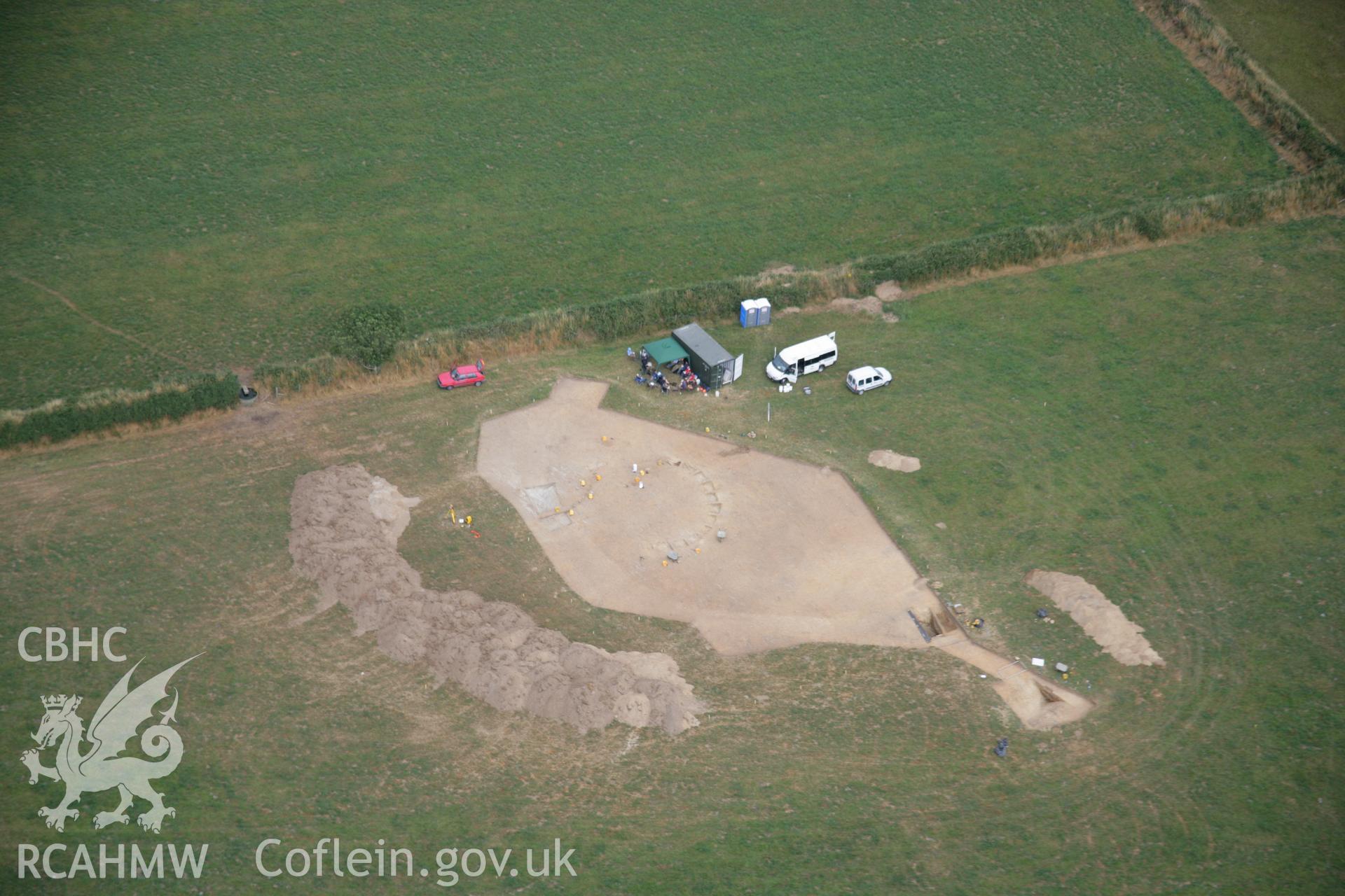 RCAHMW colour oblique aerial photograph of Ffynnonwen Defended Enclosure during excavations by the Dyfed Archaeological Trust. Taken on 27 July 2006 by Toby Driver.
