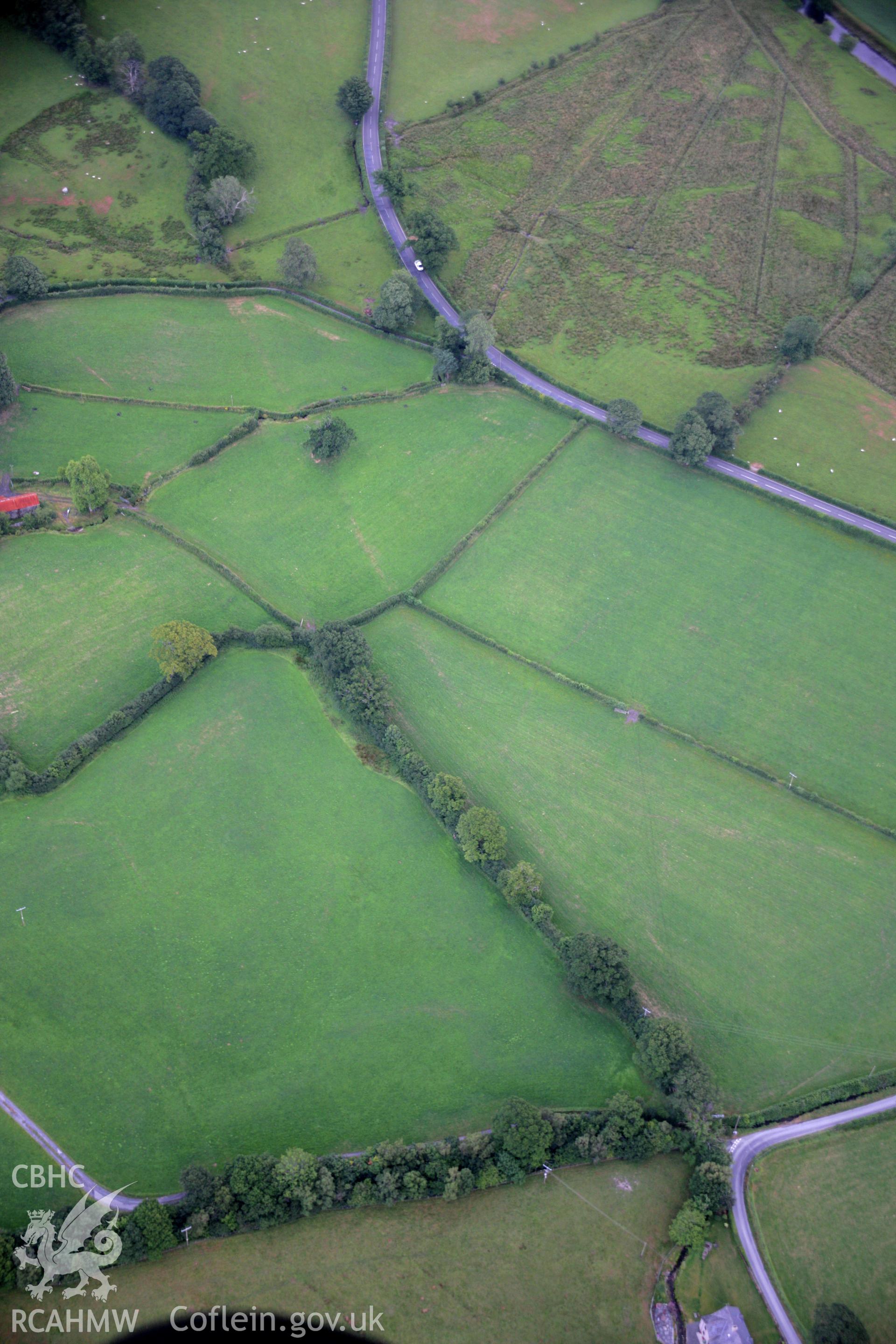 RCAHMW colour oblique aerial photograph of Caer Gai Roman Military Settlement and the nearby Roman road. Taken on 31 July 2006 by Toby Driver.