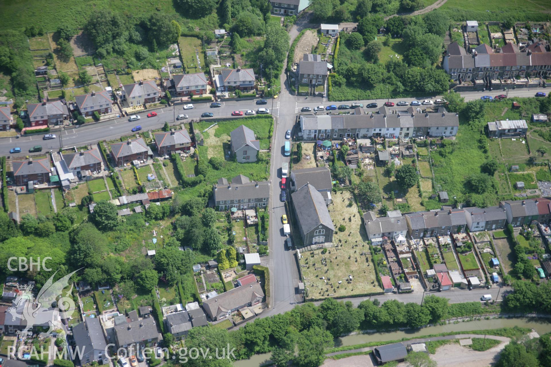 RCAHMW colour oblique aerial photograph of Trinity, Gelli-Unig Place, Pont-y-Waun, from the west. Taken on 09 June 2006 by Toby Driver.