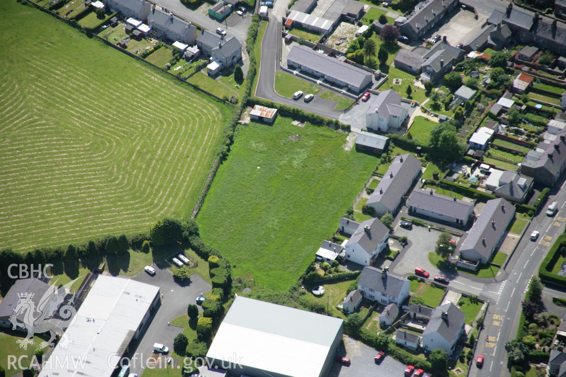 RCAHMW colour oblique aerial photograph showing partial view of Y Ffor village, viewed from east, near Salem Welsh Independent Chapel, Fourcrosses. Taken on 14 June 2006 by Toby Driver