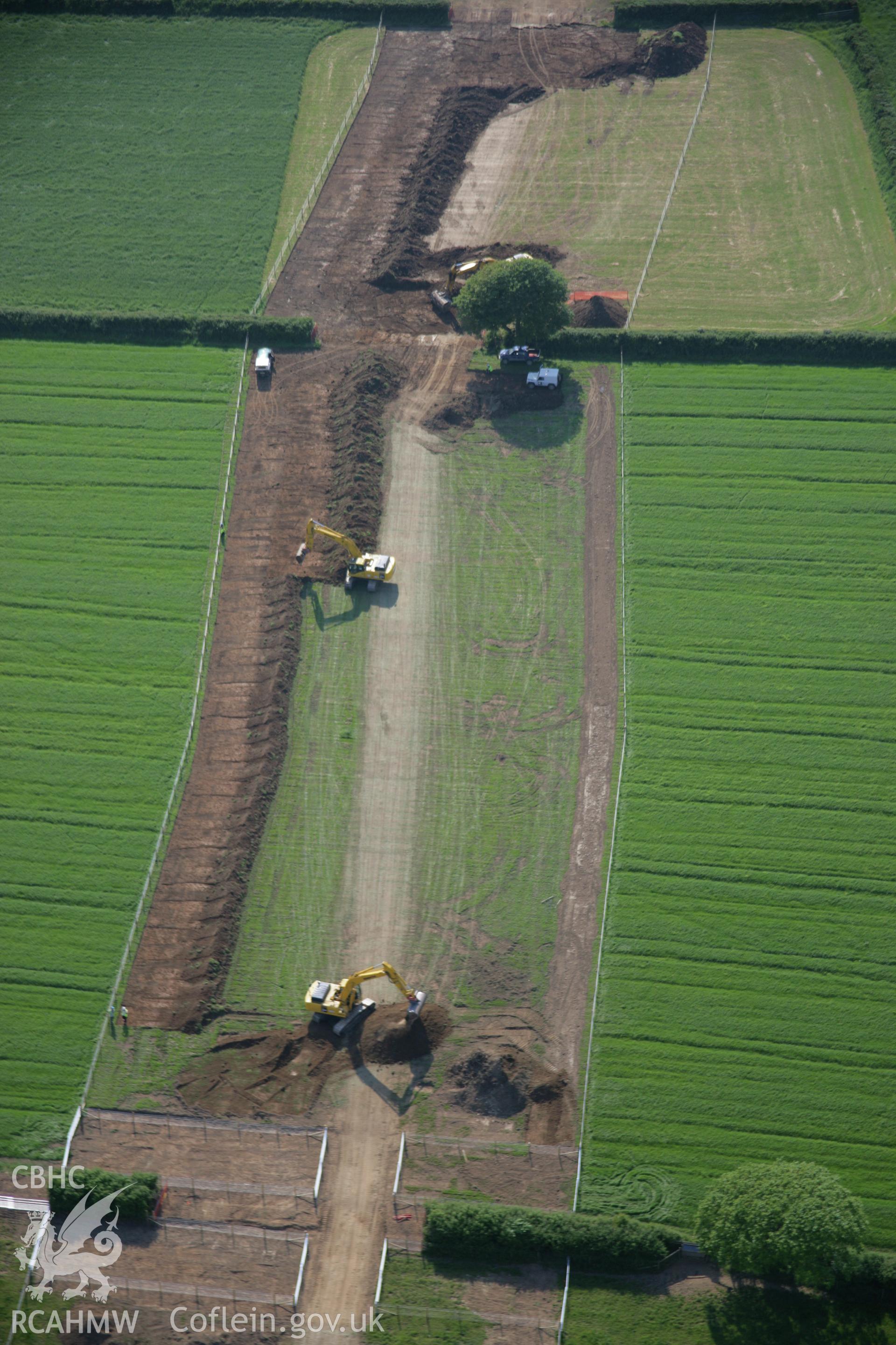 RCAHMW colour oblique aerial photograph of LNG Natural Gas Pipeline, Tavernspite, viewed looking to the west. Taken on 08 June 2006 by Toby Driver.