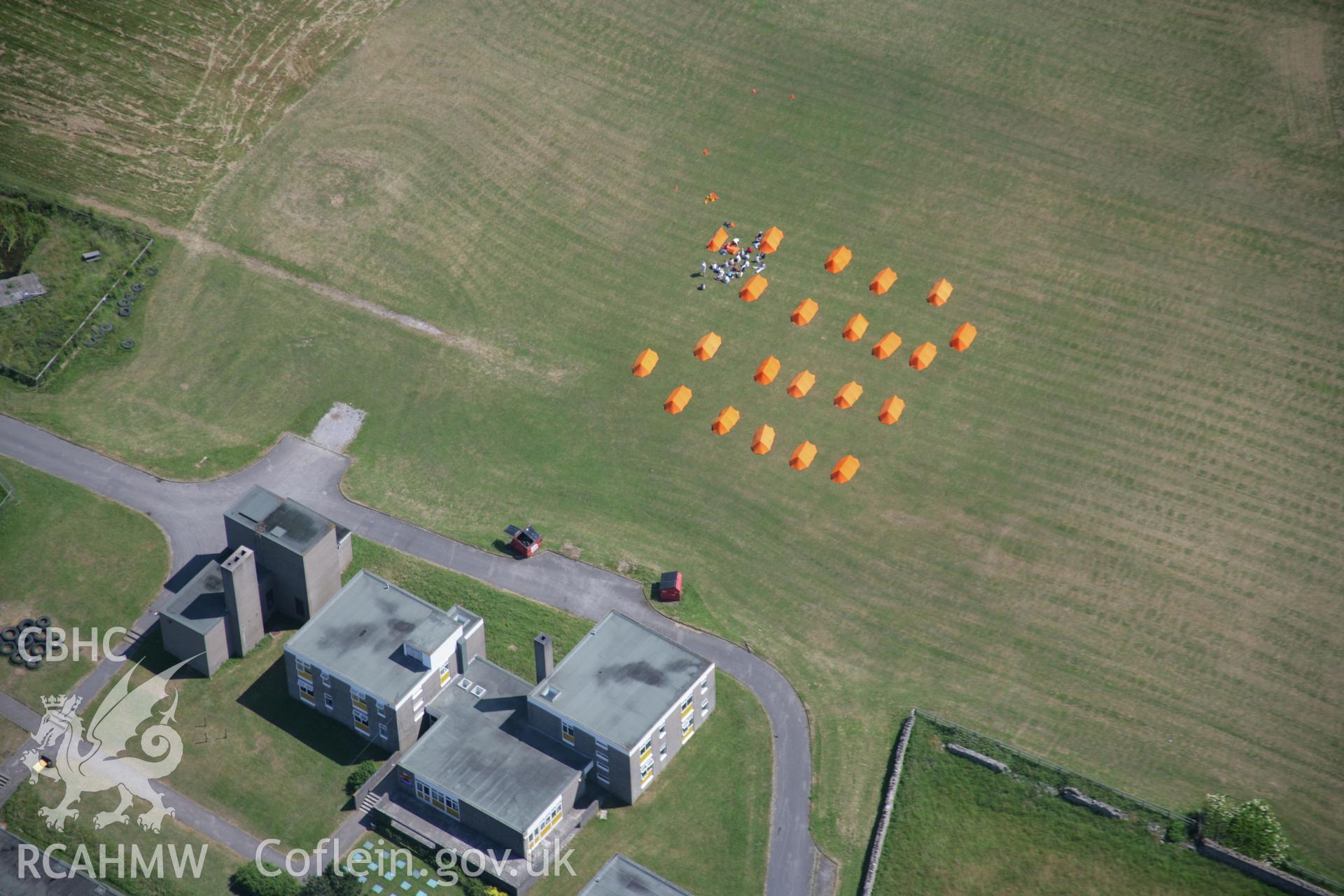 RCAHMW colour oblique photograph of Ogmore by sea, campsite on playing field. Taken by Toby Driver on 29/06/2006.