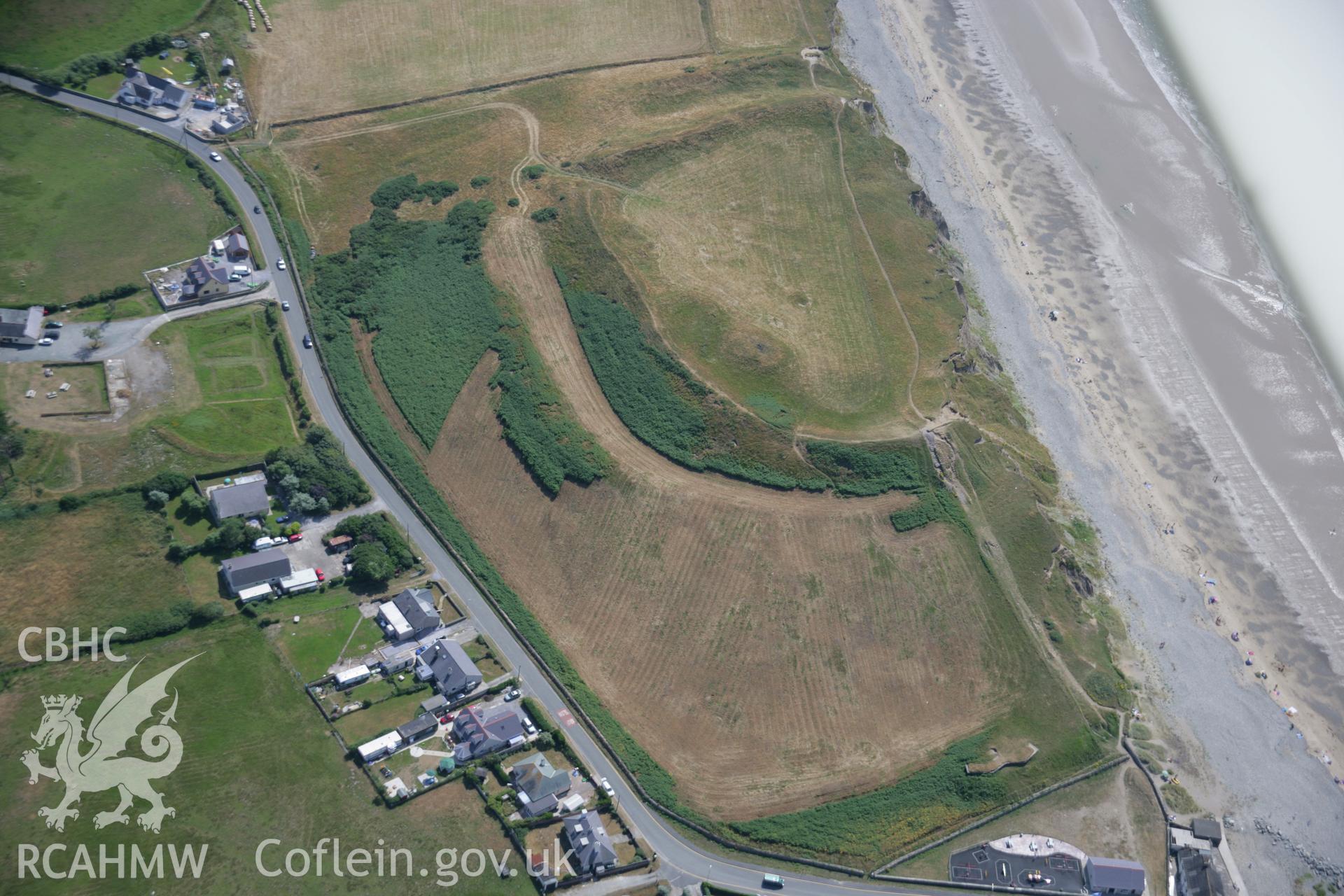 RCAHMW colour oblique aerial photograph of Dinas Dinlle Hillfort, Llandwrog. Taken on 25 July 2006 by Toby Driver.
