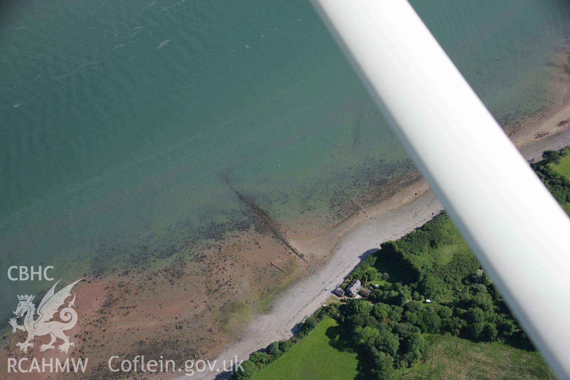 RCAHMW colour oblique aerial photograph of Gorad Ddu Fish Weir from the north-west. Taken on 14 June 2006 by Toby Driver.