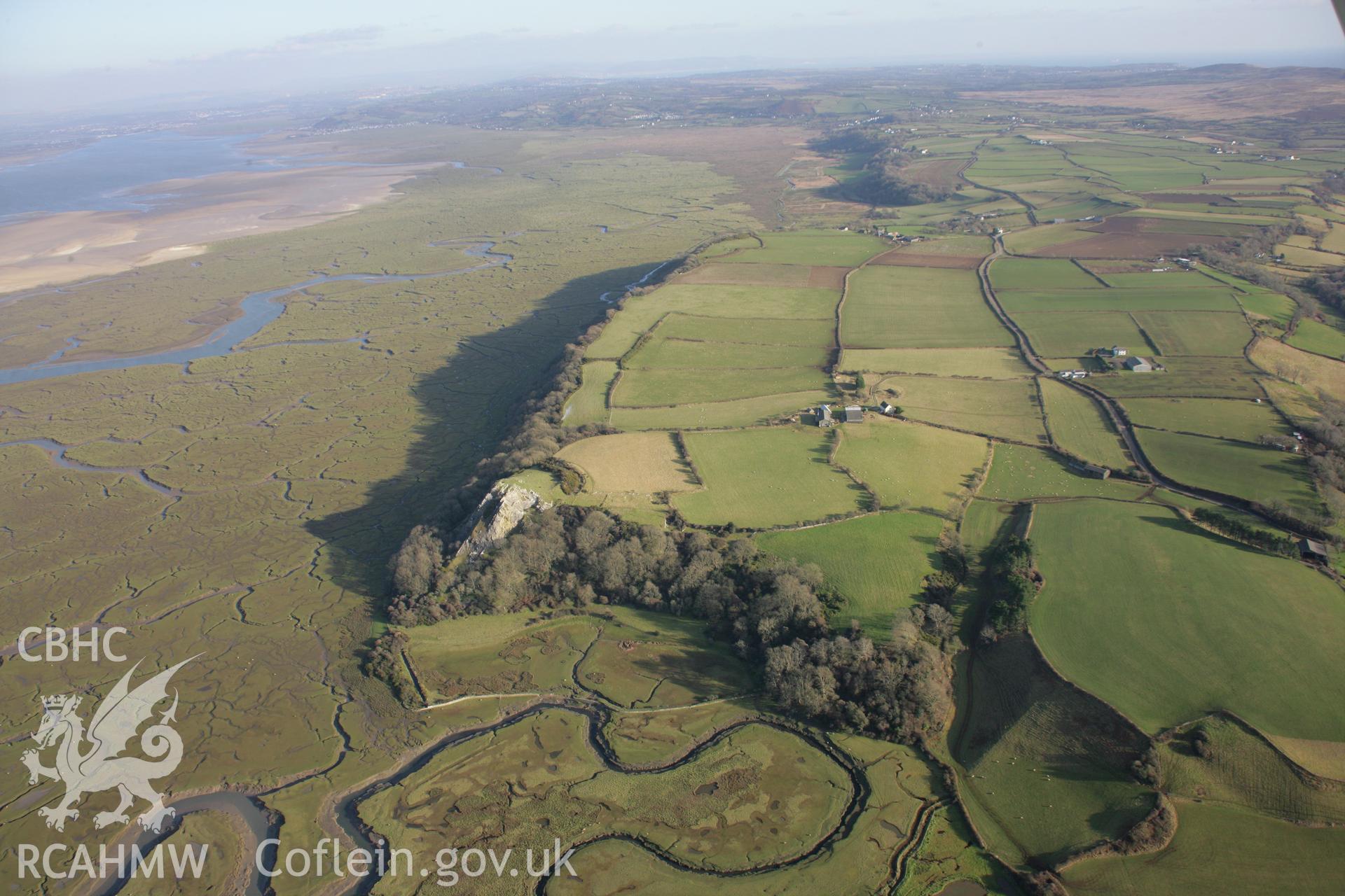 RCAHMW colour oblique aerial photograph of North Hill Tor Defended Enclosure and promontary fort in wide landscape view from the west. Taken on 26 January 2006 by Toby Driver.