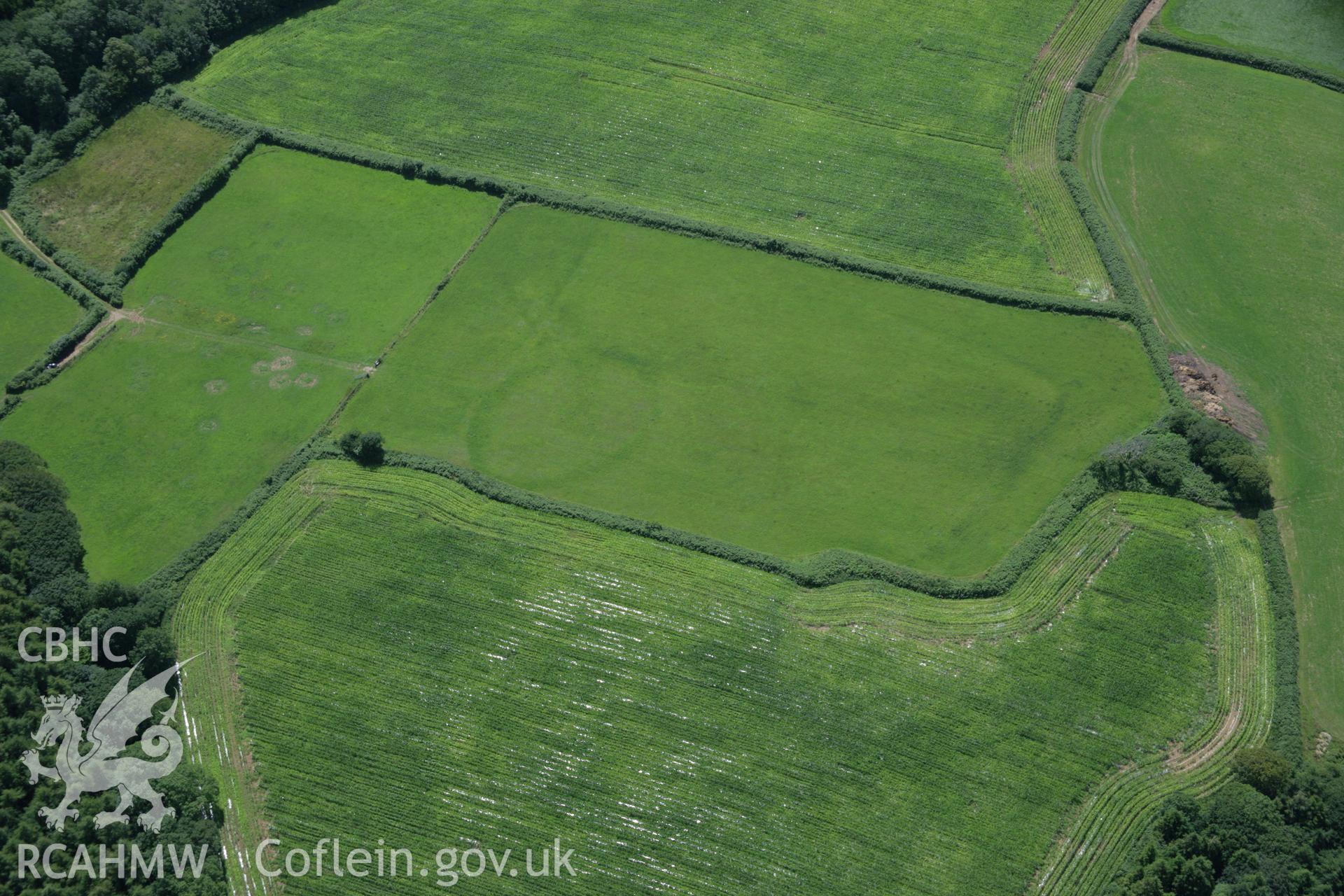 RCAHMW colour oblique aerial photograph of Dan-y-Coed Enclosure. Taken on 11 July 2006 by Toby Driver.