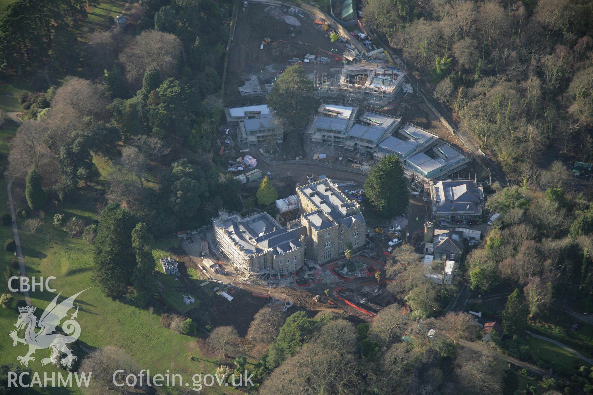 RCAHMW colour oblique aerial photograph of Clyne Castle, Mumbles, from the east with housing development in progress. Taken on 26 January 2006 by Toby Driver.